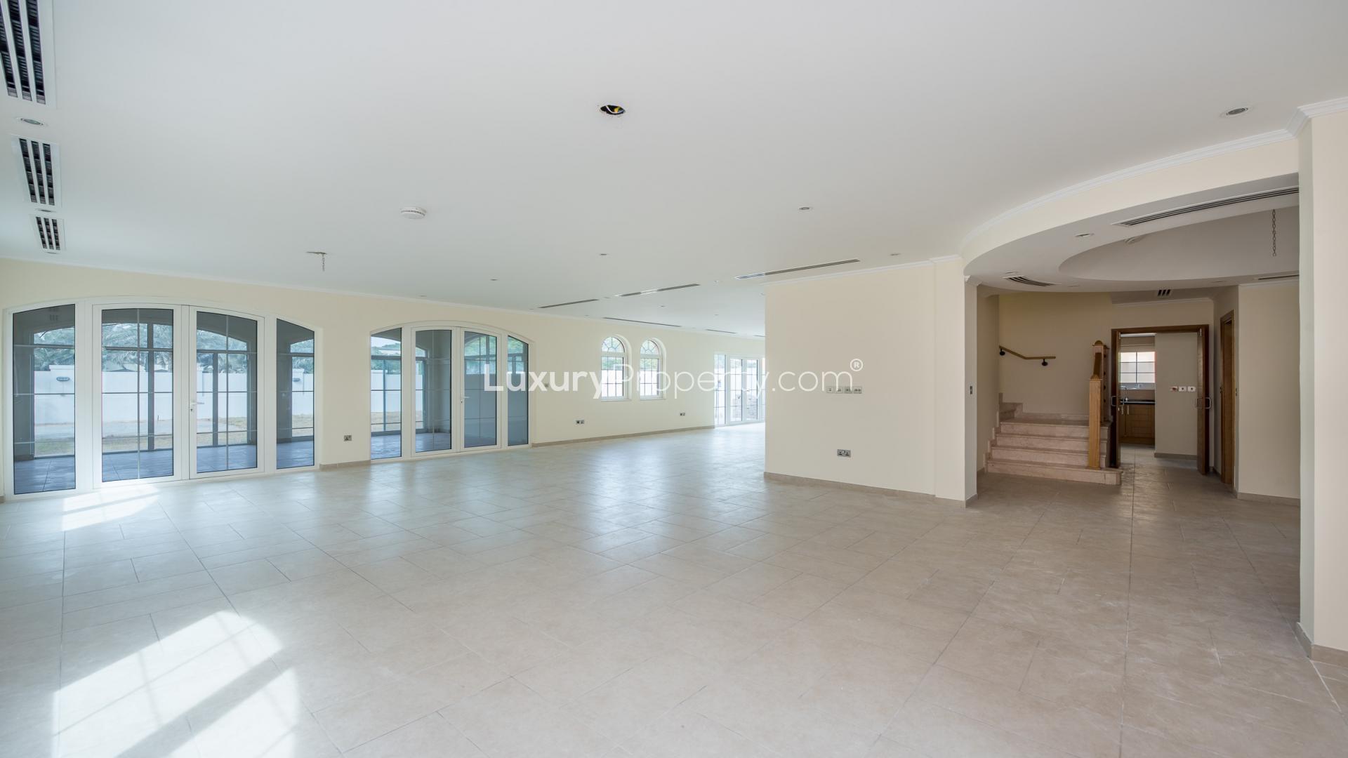 Legacy Villa exterior with driveway and greenery in Jumeirah Park, available for rent