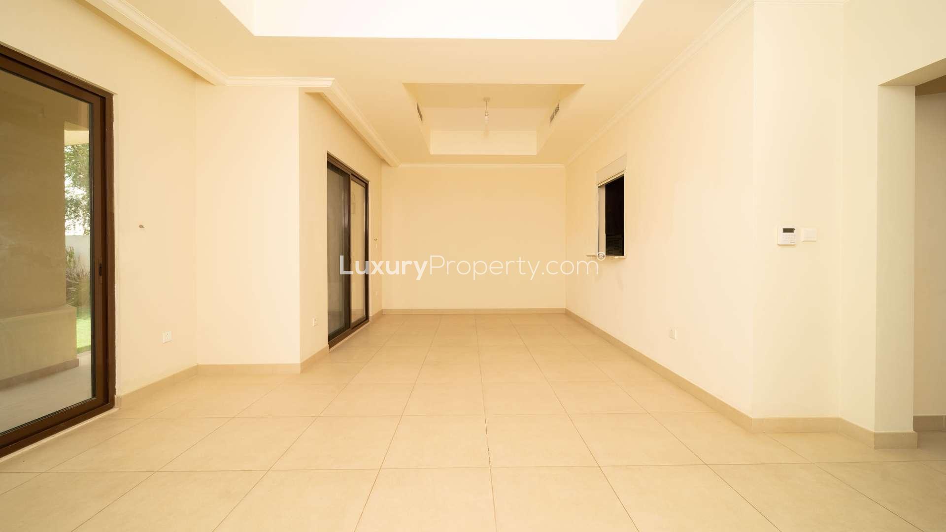 Spacious living room with large windows in Lila villa, Arabian Ranches 2, available for rent