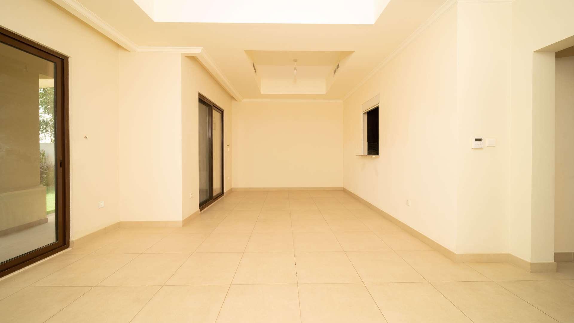 Spacious living room with large windows in Lila villa, Arabian Ranches 2, available for rent