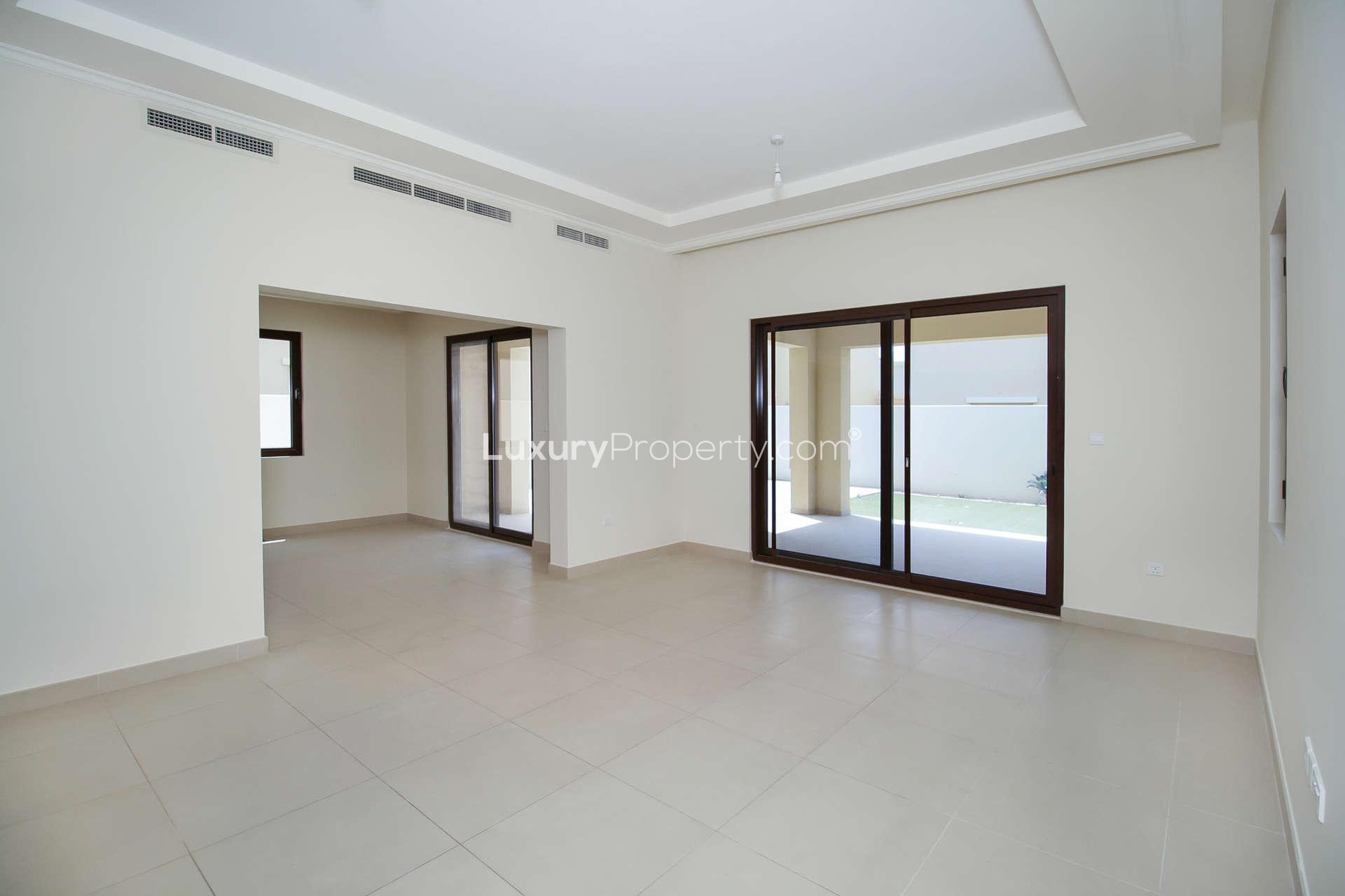 Empty bedroom with wooden doors in 5-bedroom villa, Lila, Arabian Ranches 2