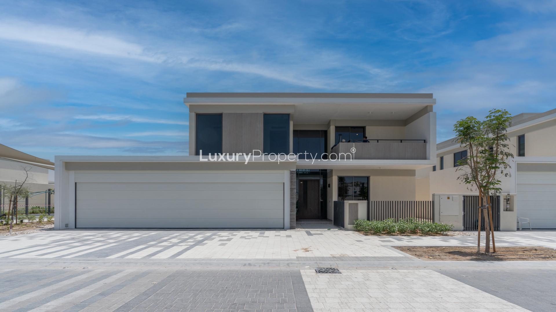 Bright, spacious interior of vacant 5-bedroom villa with marble floors in Tilal Al Ghaf