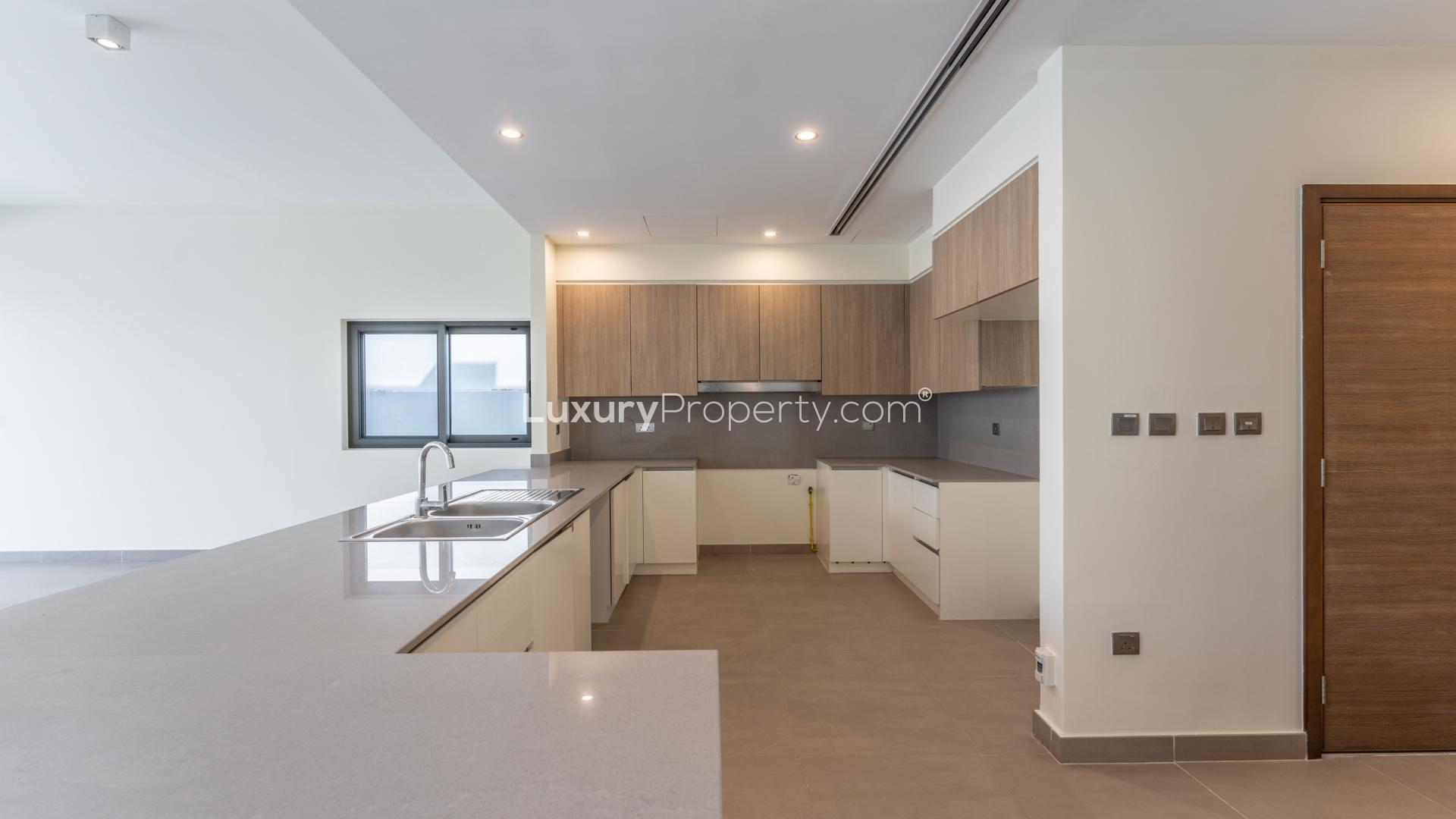 Exterior view of Sidra Villas in Dubai Hills Estate, featuring lush garden and modern design