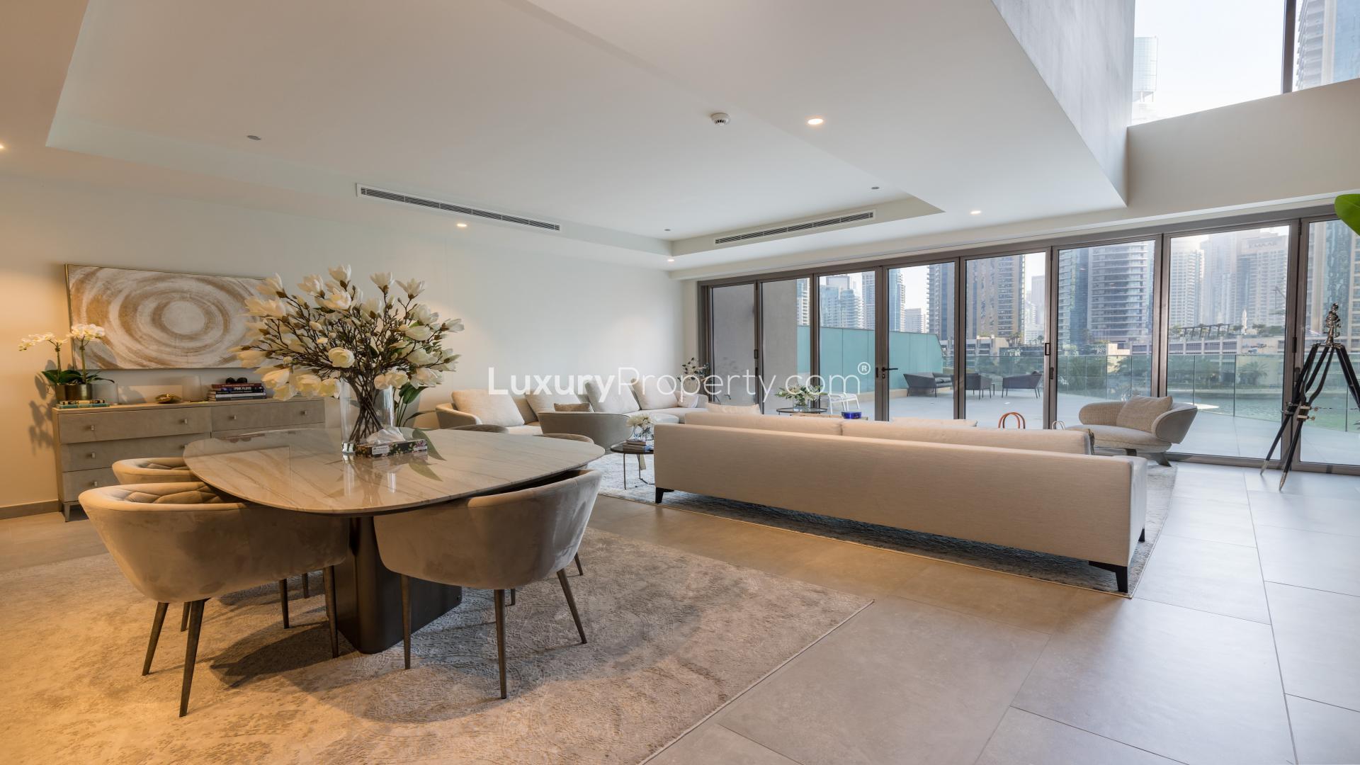 "Scenic view from 5-bed villa balcony overlooking Dubai Marina and luxury yachts at Marina Gate.",Luxurious living room in 5-bed villa, Marina Gate, Dubai Marina, available for rent