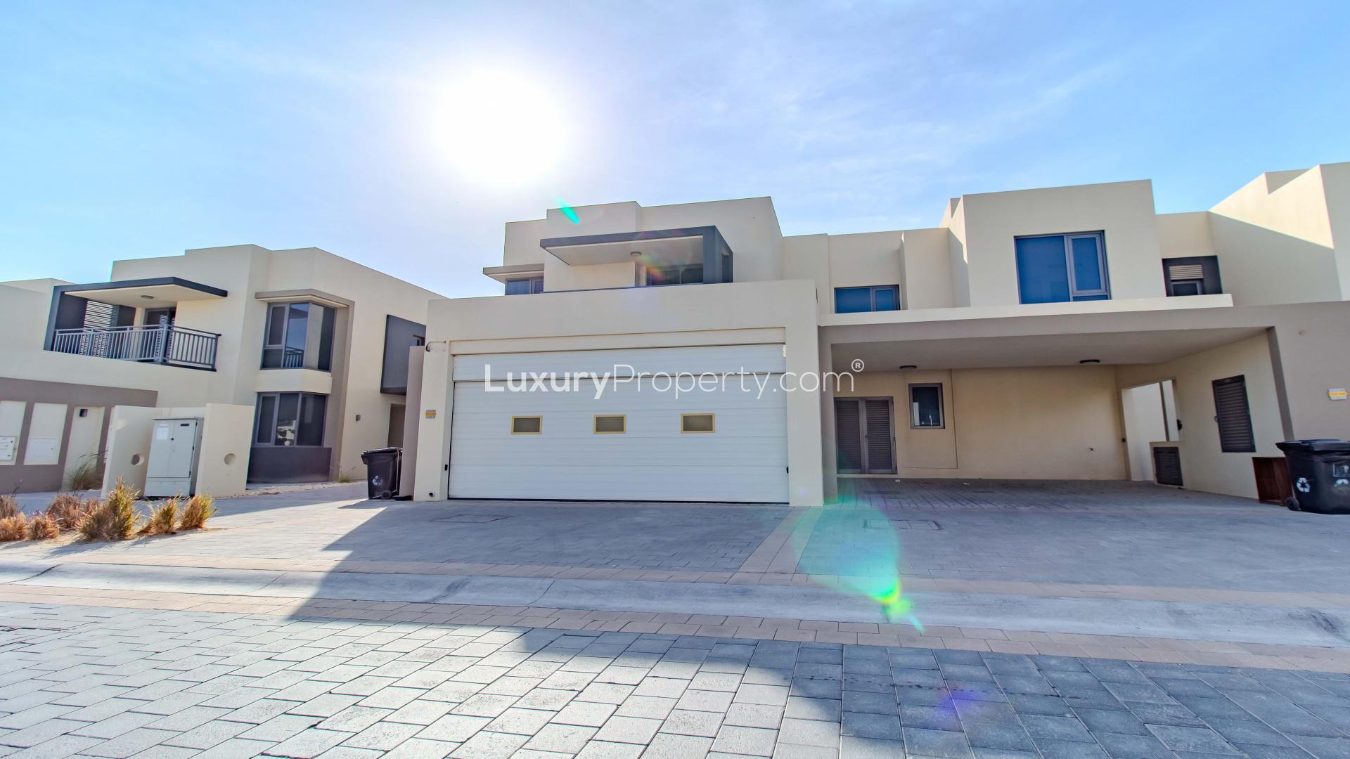 Modern open-plan kitchen and living area in Maple villa, Dubai Hills Estate