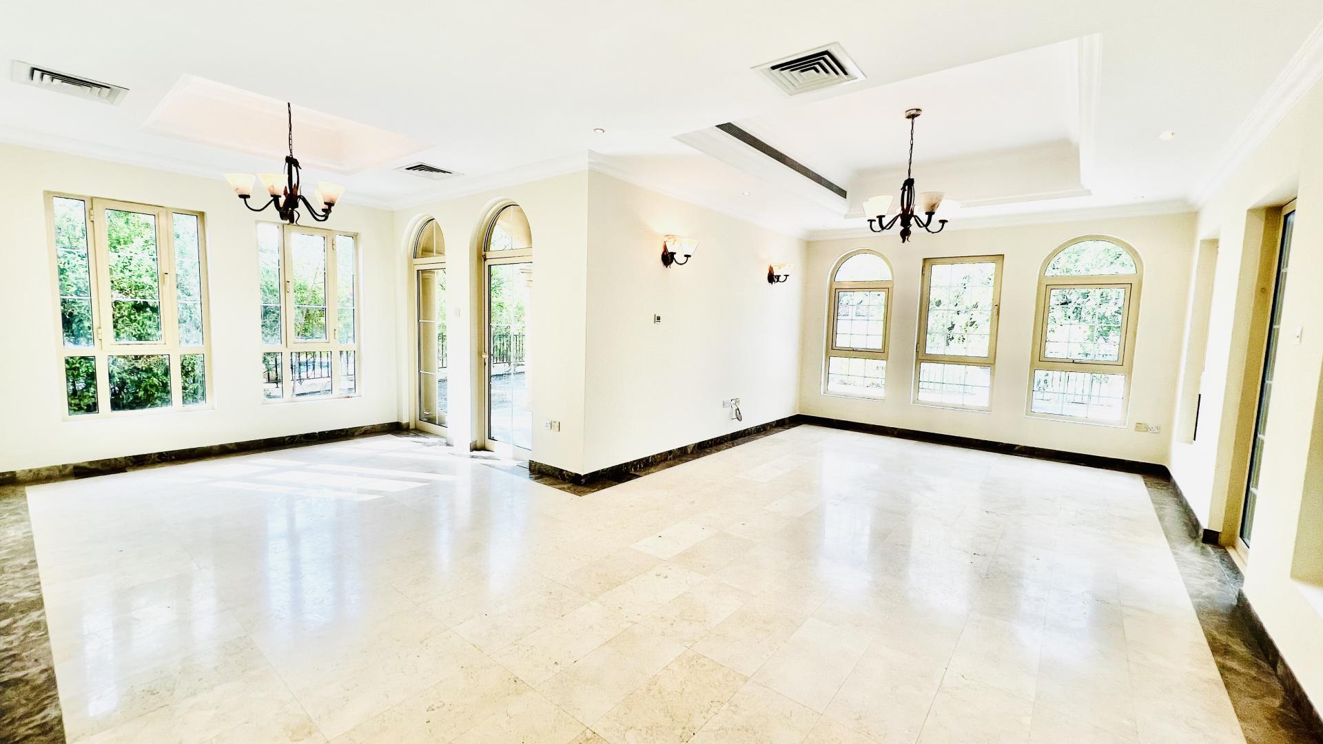"Spacious kitchen in unfurnished Jumeirah Islands villa for rent, featuring modern appliances.",Unfurnished villa interior with elegant chandeliers in Jumeirah Islands, European Clusters, for rent