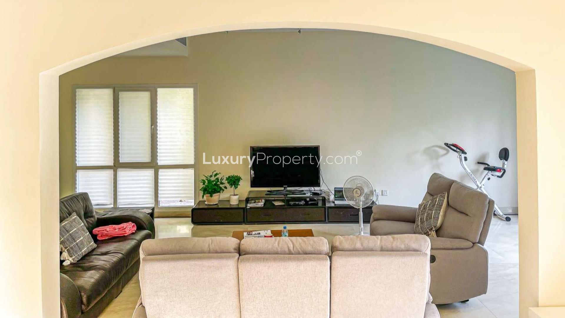 N/A,Living room in spacious Meadows 2 villa with modern decor and entertainment setup