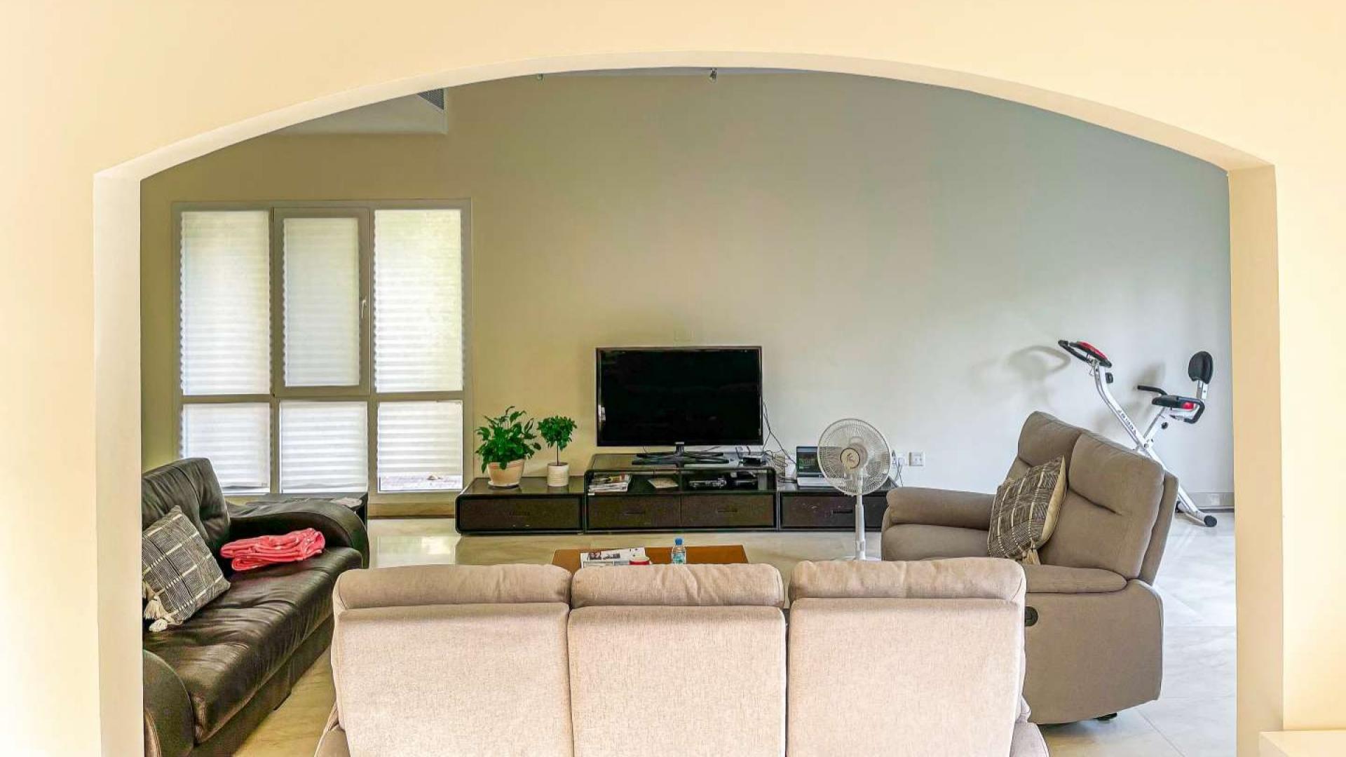 N/A,Living room in spacious Meadows 2 villa with modern decor and entertainment setup