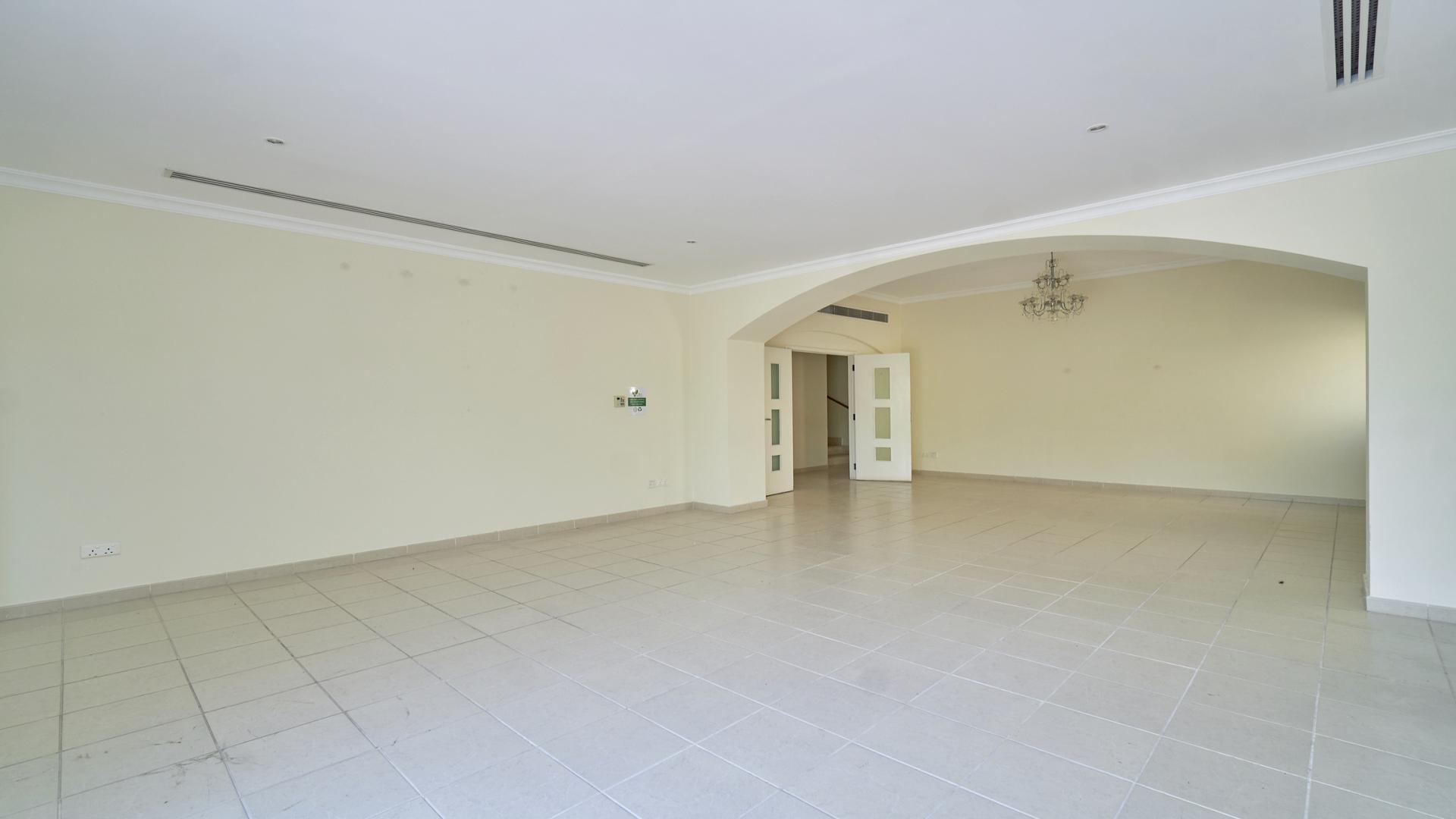 Spacious living area in 5-bedroom villa, Meadows 9, Emirates Living, with tiled floors
