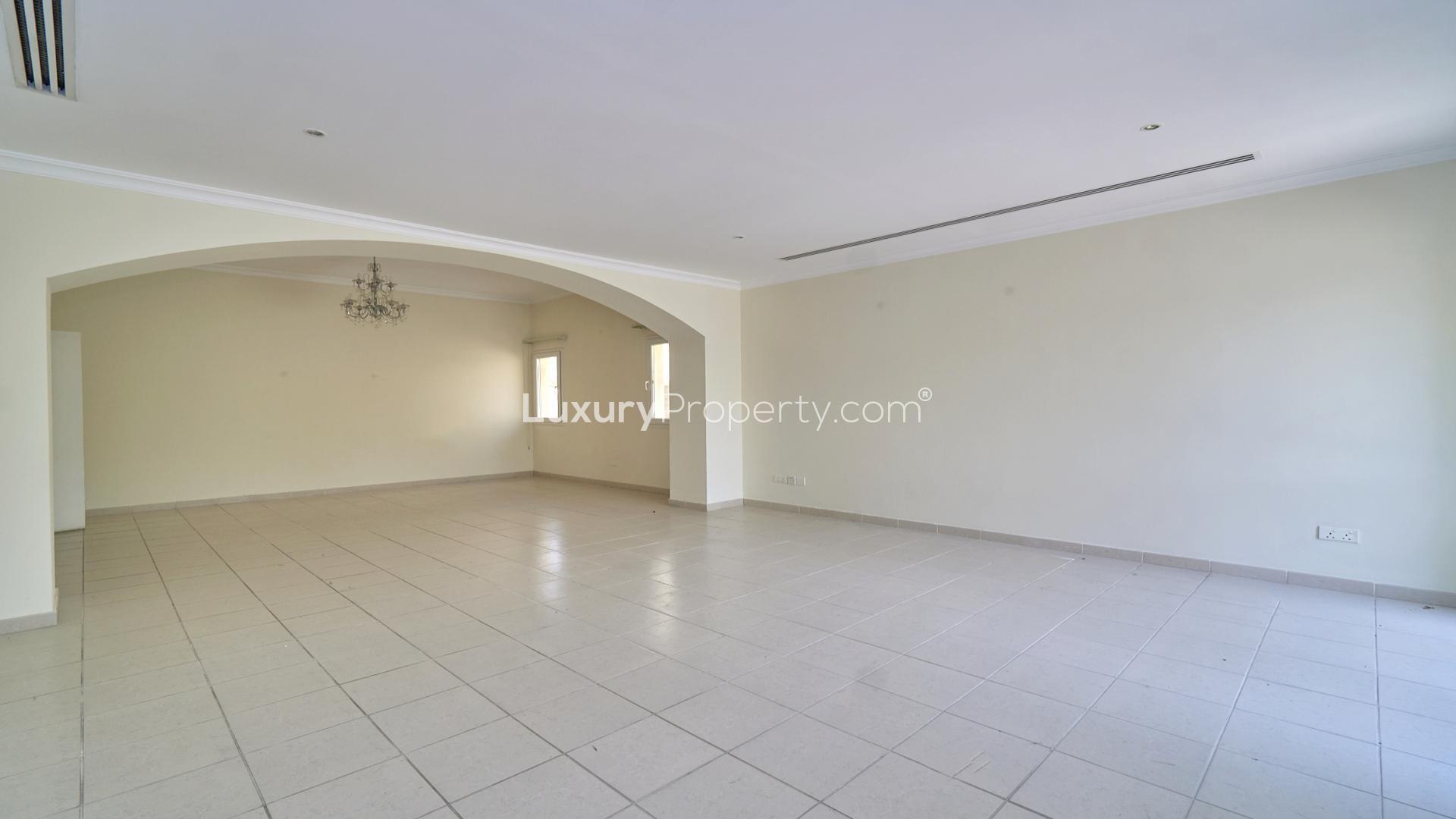 Spacious living area in 5-bedroom villa, Meadows 9, Emirates Living, with garden view