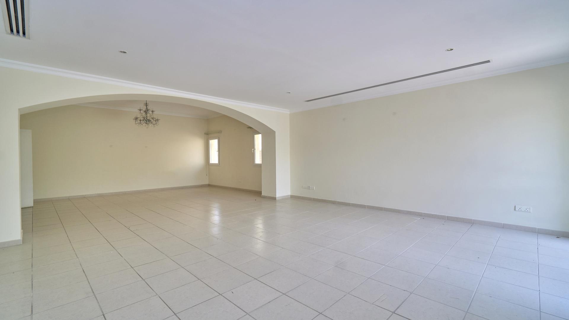 Spacious living area in 5-bedroom villa, Meadows 9, Emirates Living, with garden view