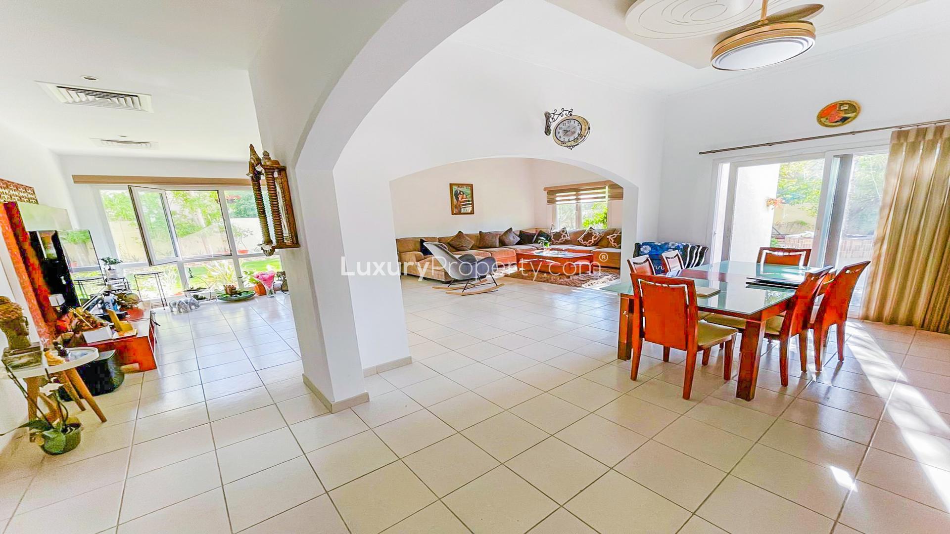 Spacious living and dining area in Meadows 8 villa with upgraded kitchen