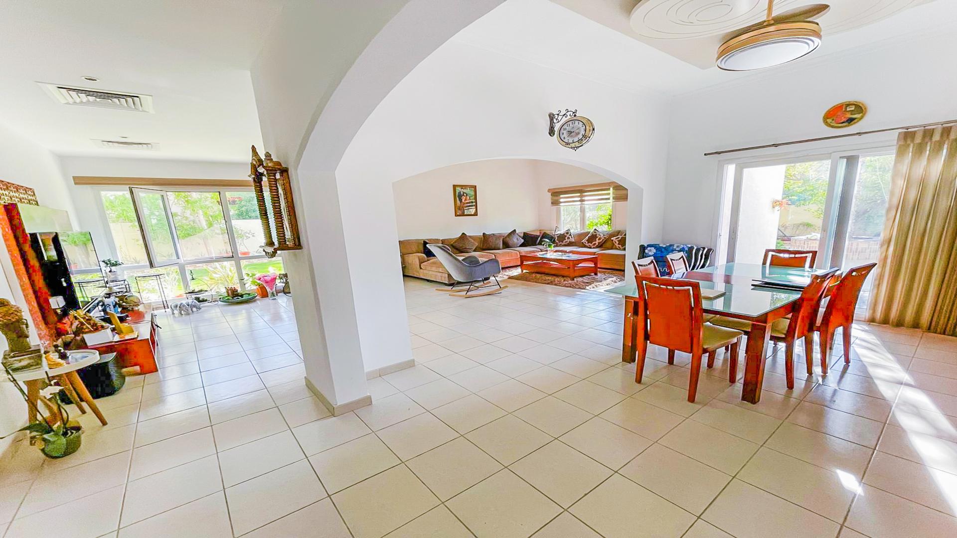 Spacious living and dining area in Meadows 8 villa with upgraded kitchen