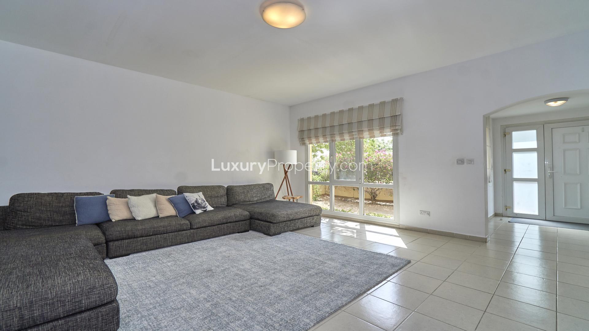 N/A,Spacious living room in immaculate Meadows 6 villa, featuring modern decor and natural light