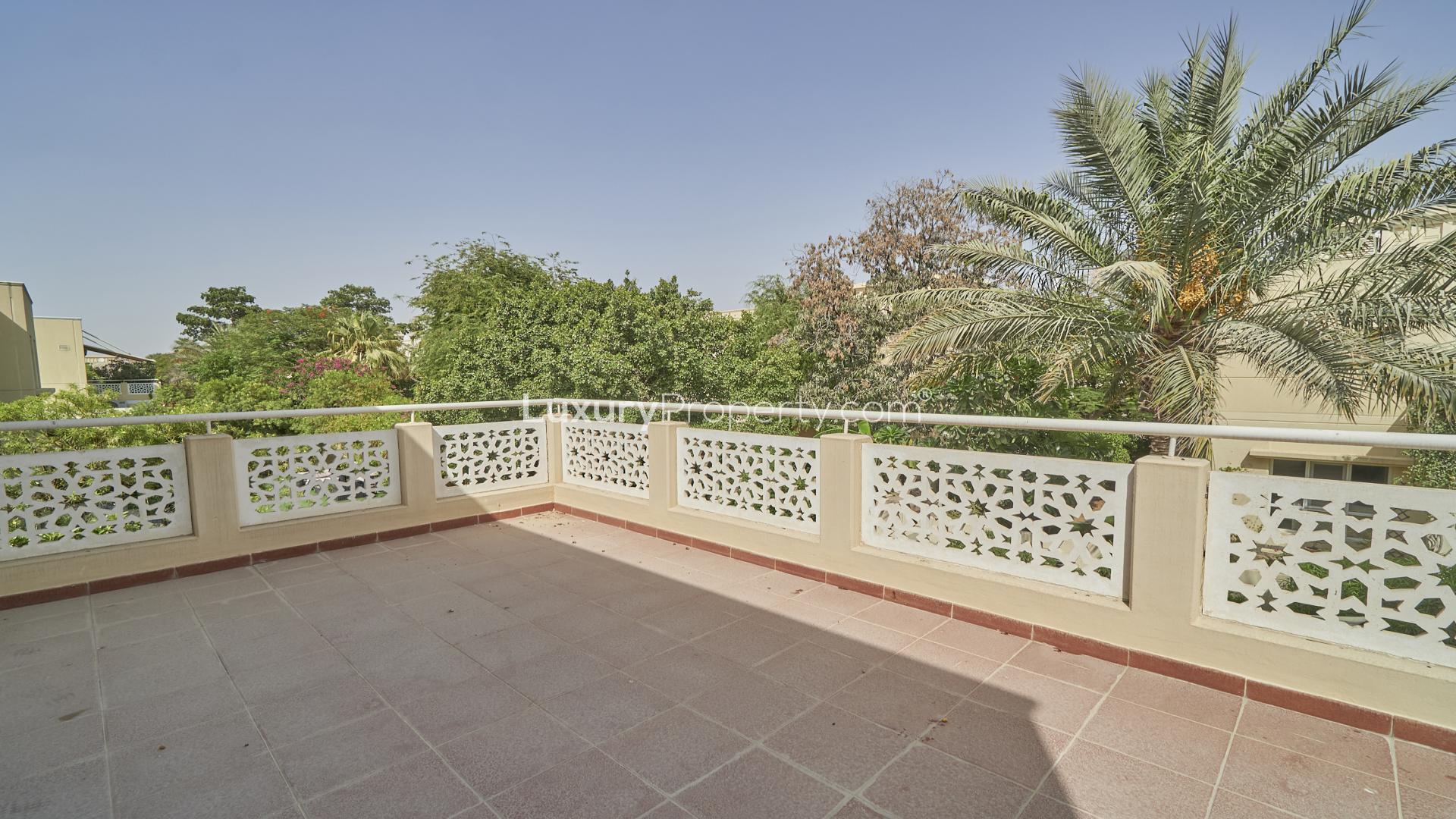 Spacious living room in Meadows 6 villa with modern decor and large sectional sofa