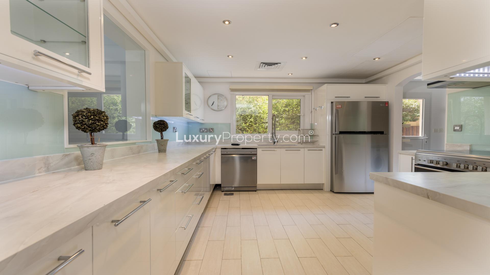 Modern kitchen in fully upgraded Meadows 7 villa with sleek appliances and bright interiors