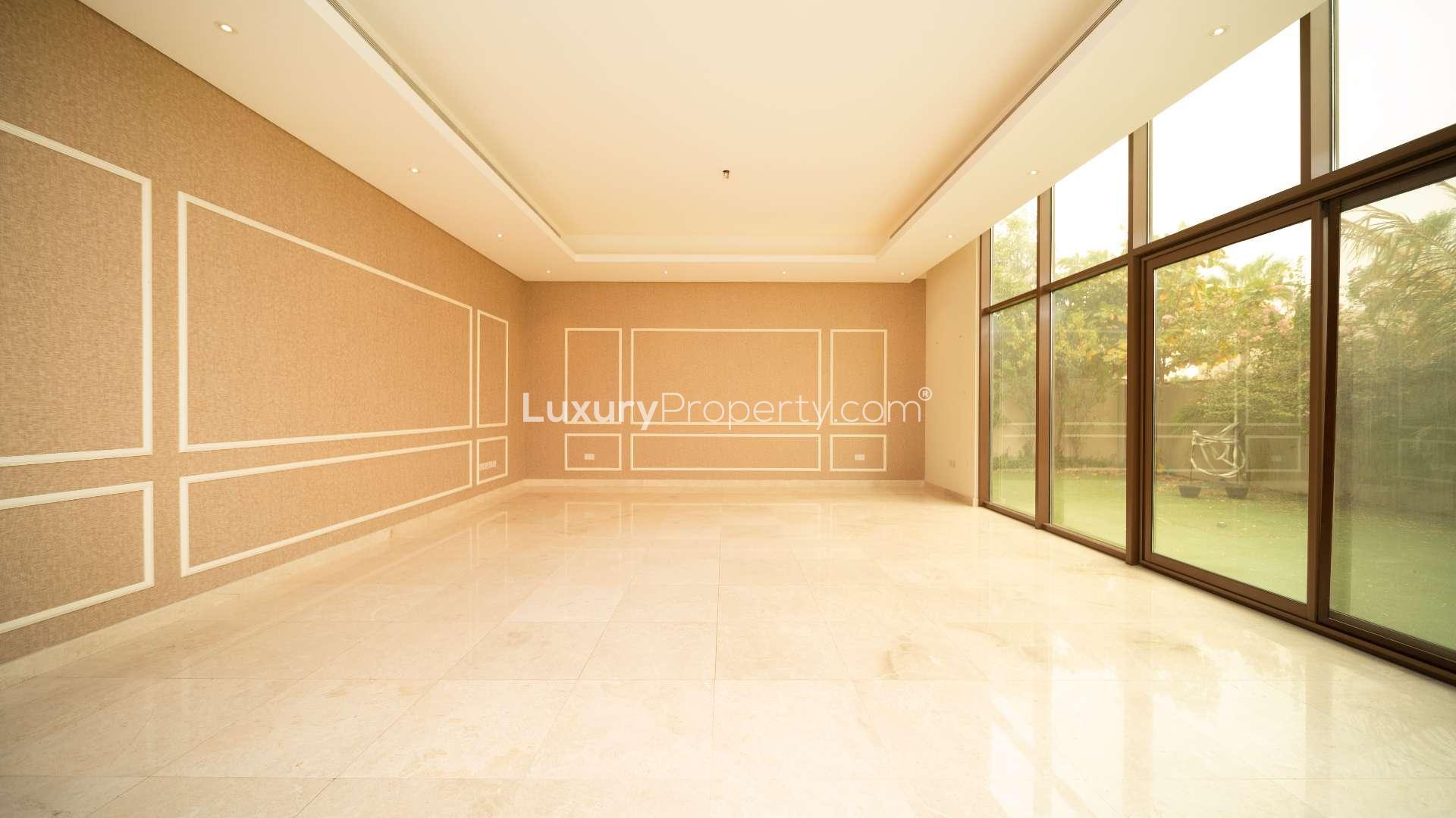 Spacious living room with large windows in Meydan villa, Millennium Estates