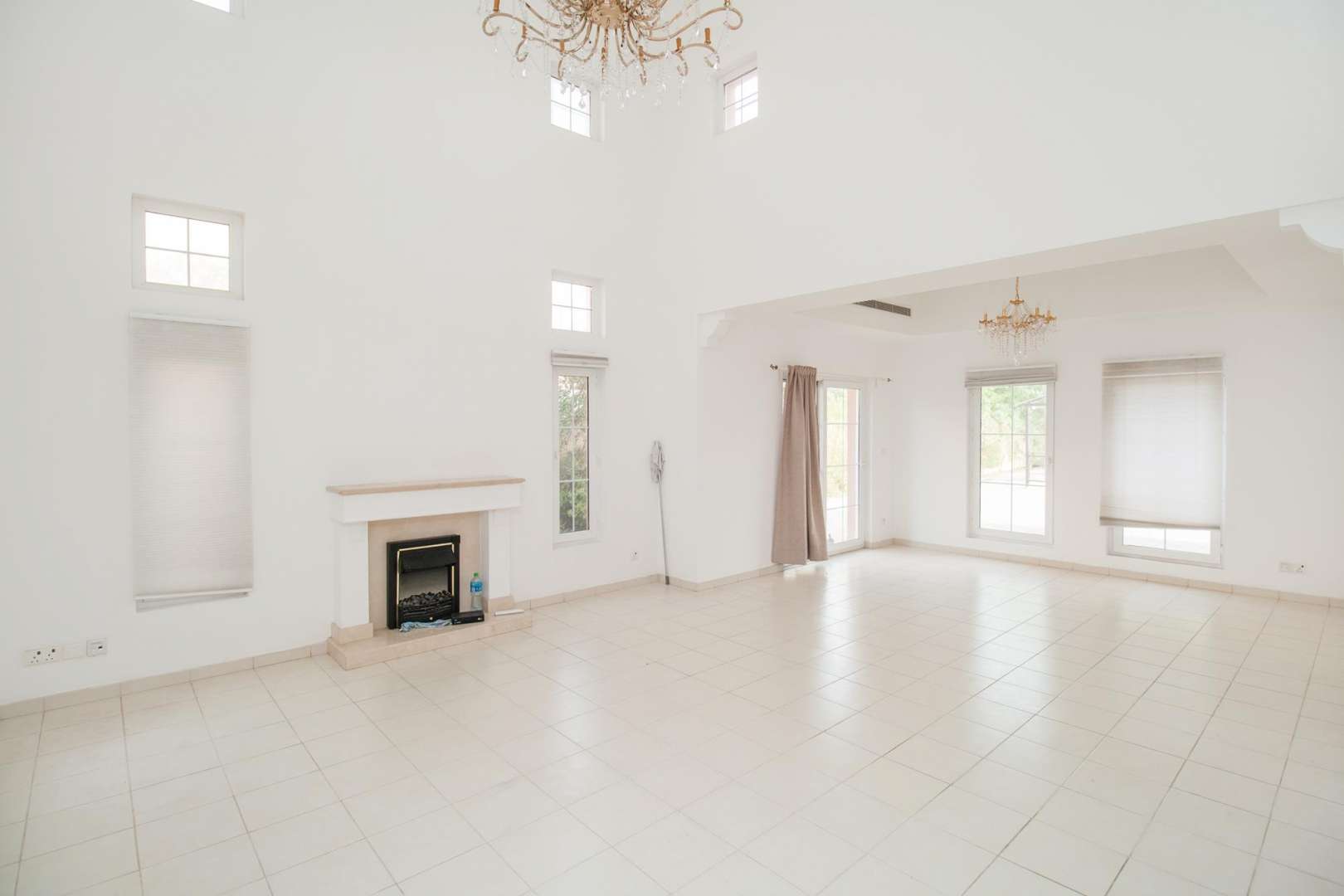 Spacious living room with fireplace in 5-bedroom villa, Mirador La Coleccion, Arabian Ranches