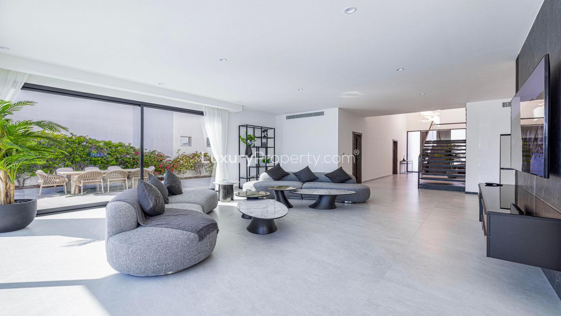 Stunning Palm Jumeirah villa with private pool, modern design, and beachfront views for rent