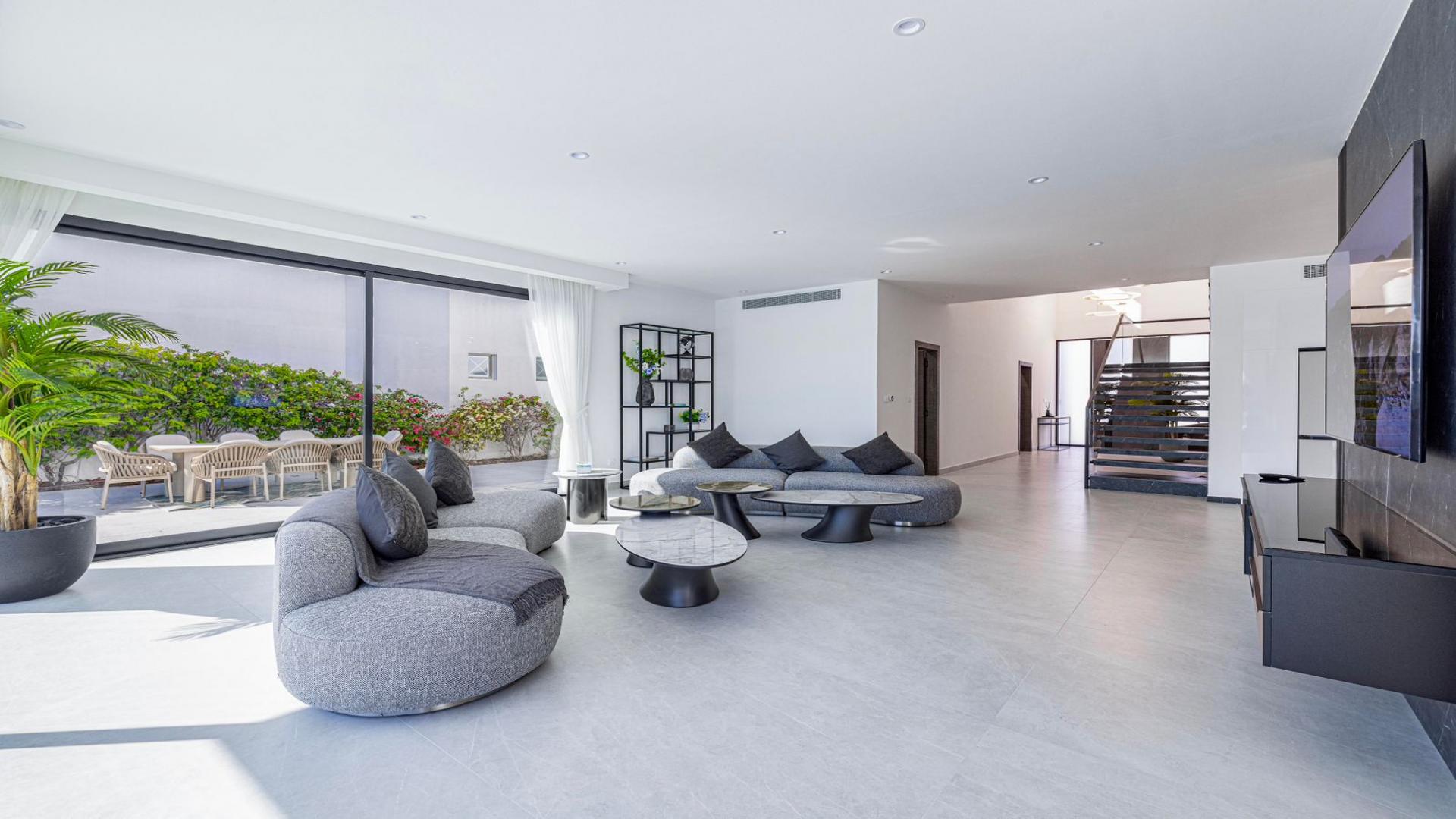 Stunning Palm Jumeirah villa with private pool, modern design, and beachfront views for rent