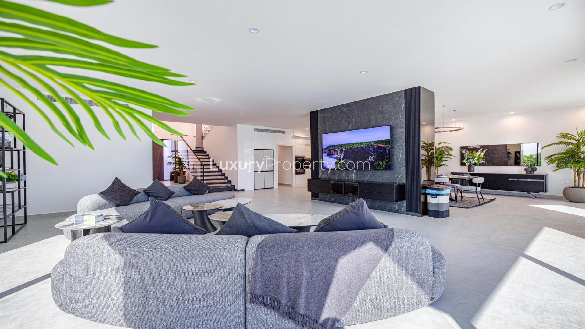 "Spacious living room in fully upgraded 5-bedroom villa, Palm Jumeirah Garden Homes.",Luxurious open-plan living area in upgraded 5-bedroom villa, Garden Homes, Palm Jumeirah