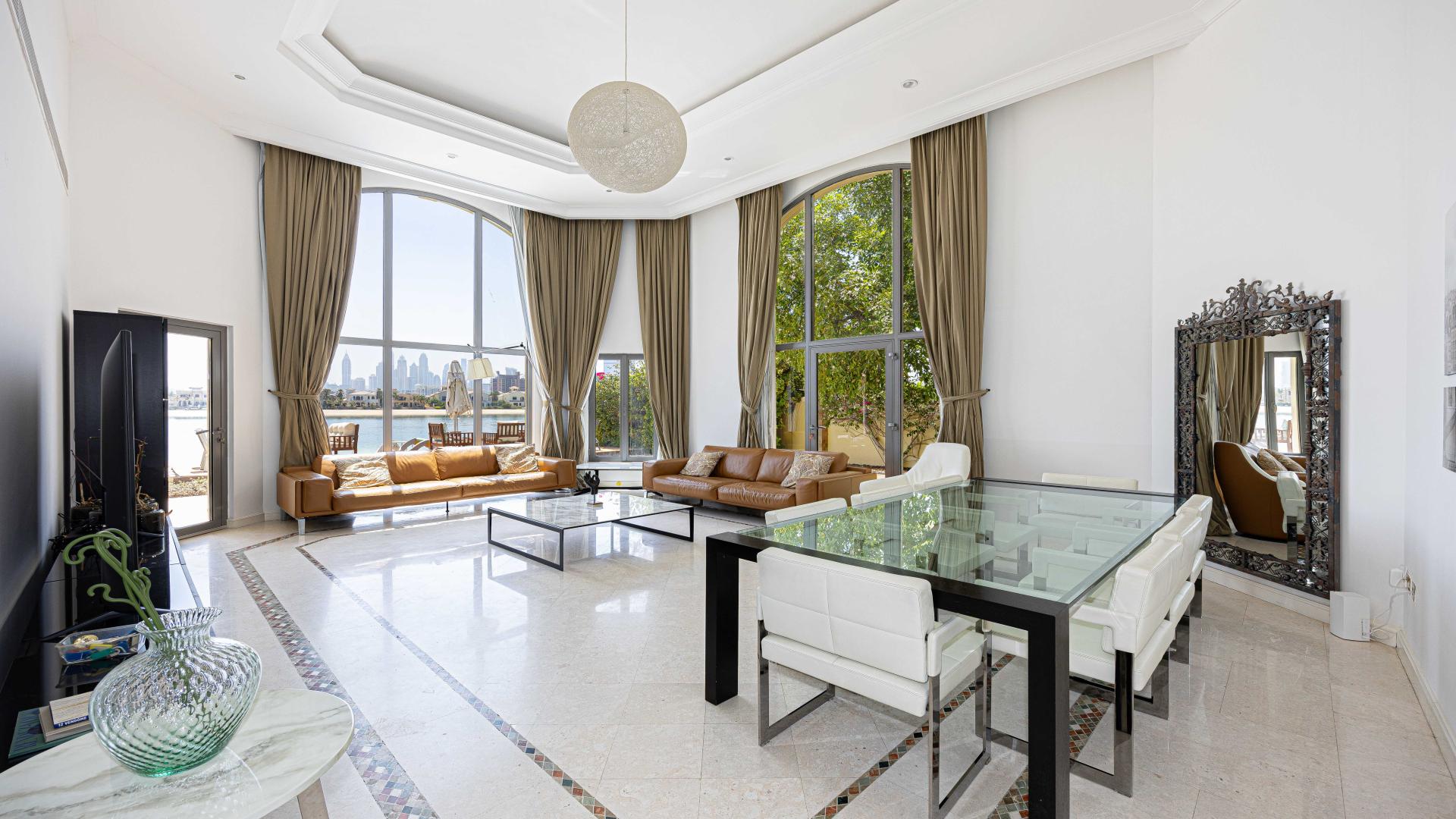 Balcony view from Central Rotunda Villa overlooking beach and skyline in Palm Jumeirah