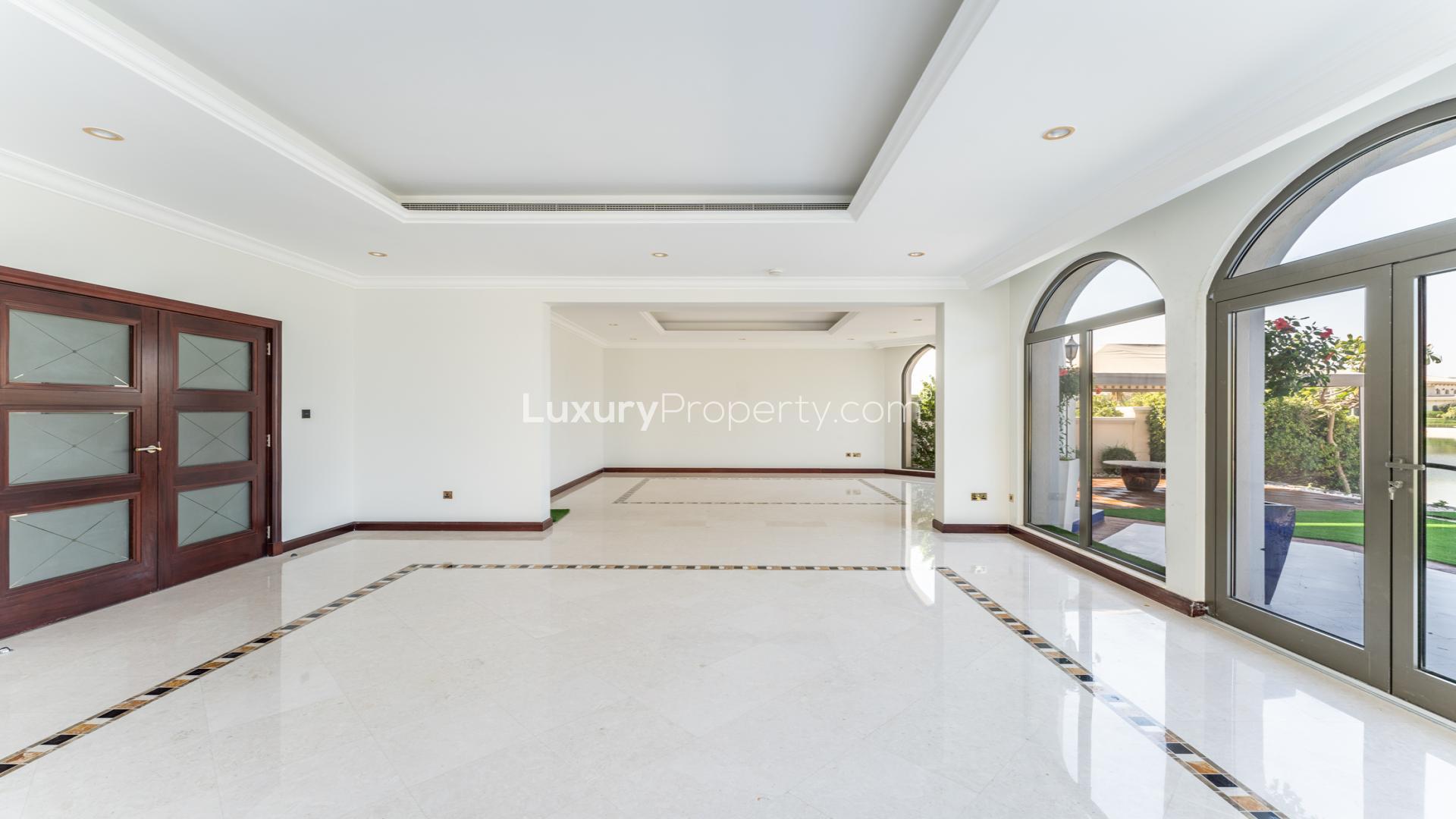 Luxurious Palm Jumeirah villa garden with stunning waterfront and Atlantis views