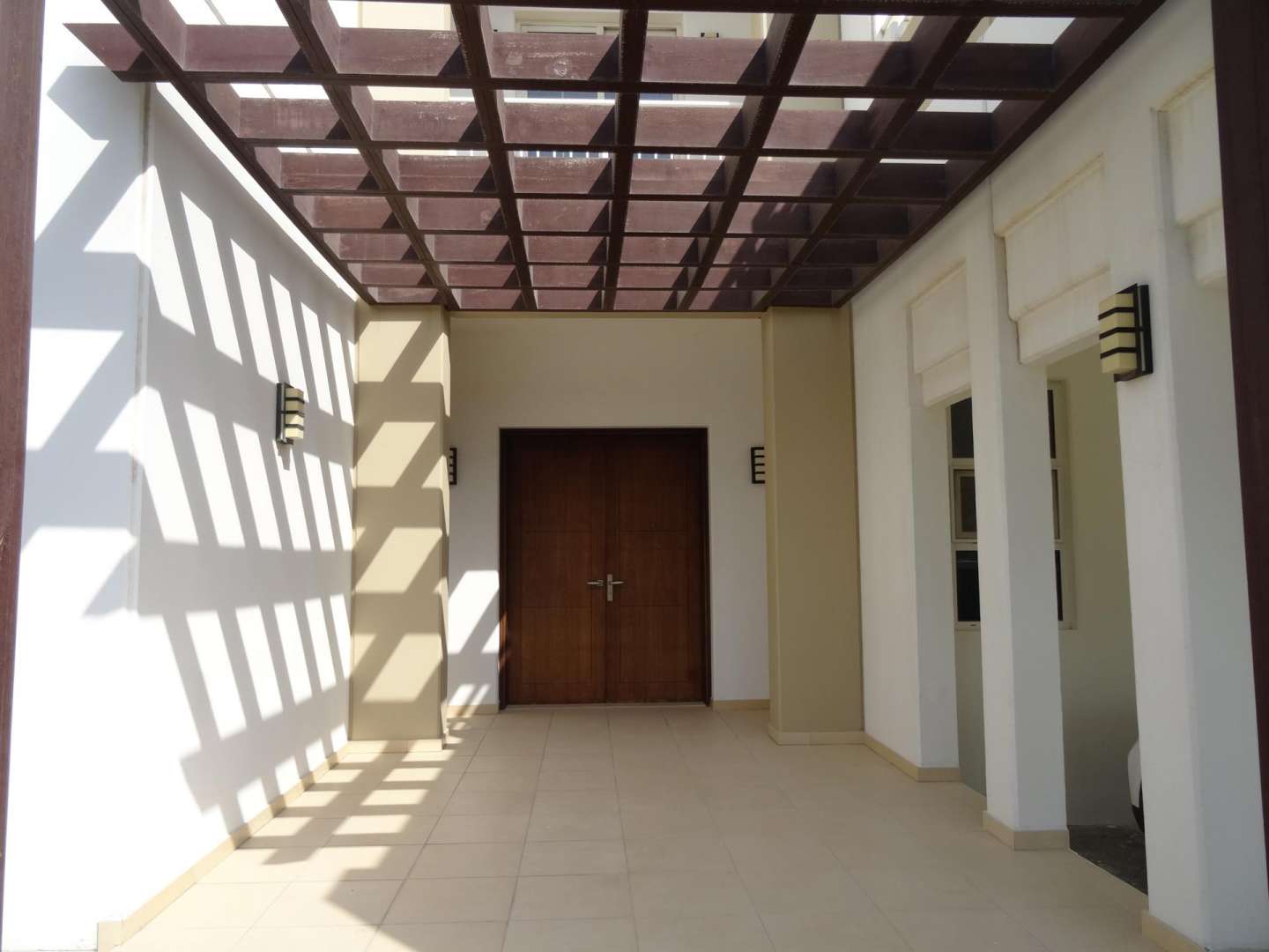 Spacious 5-bedroom villa exterior with landscaped garden in Mudon, Naseem community, for rent