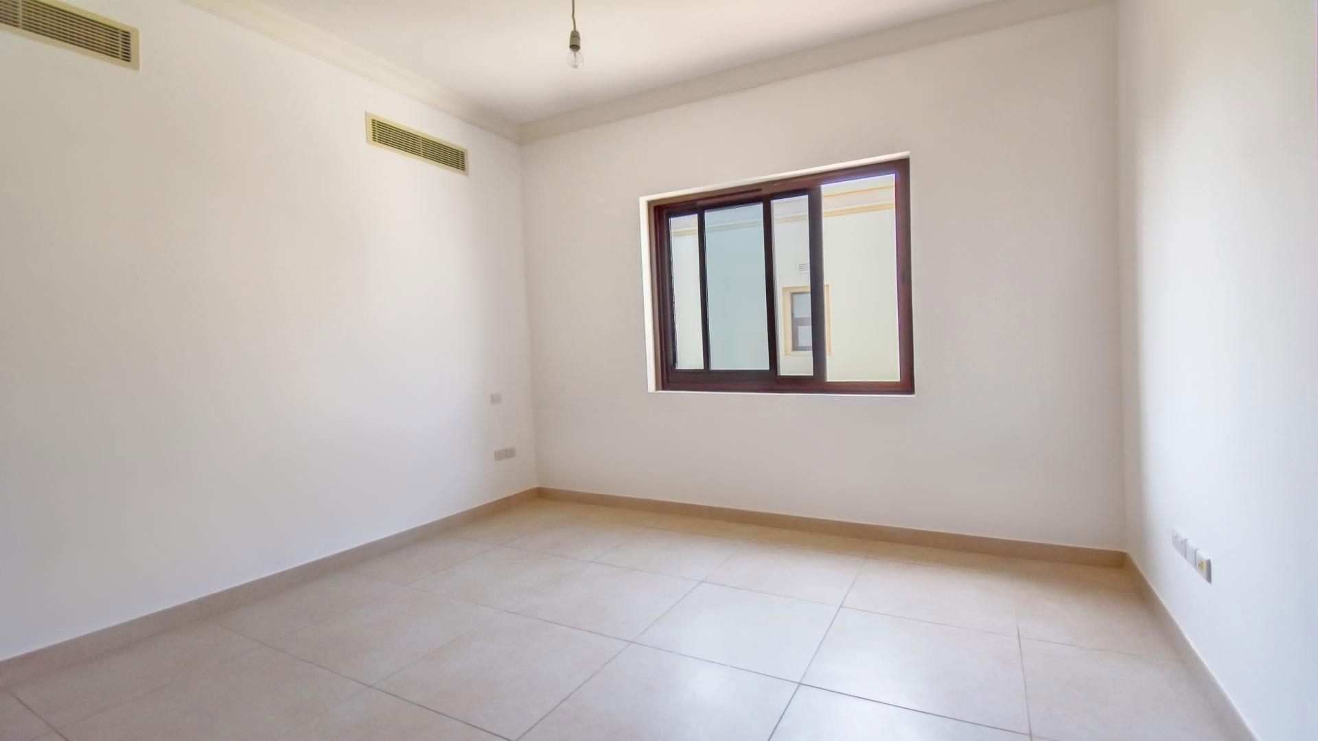 Empty bedroom in Palma villa, Arabian Ranches 2, with en-suite bathroom and staircase view