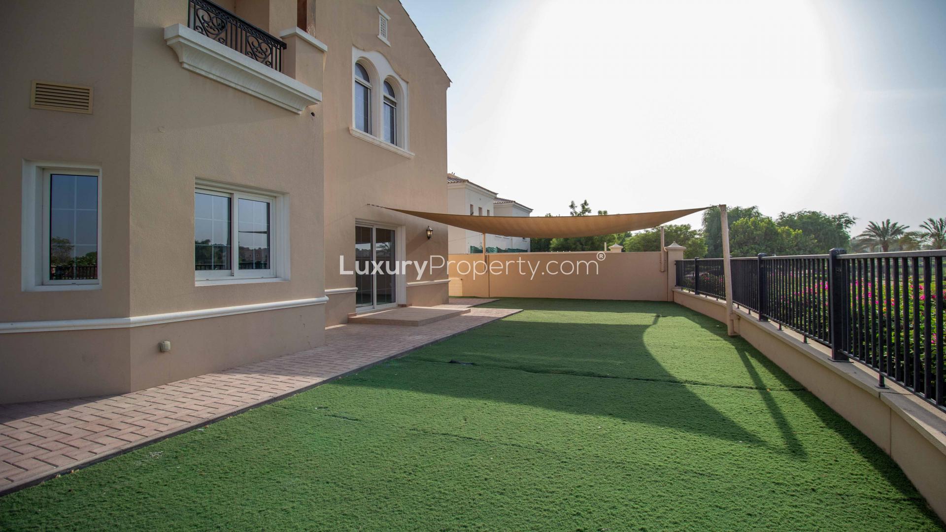 Spacious living room in luxury villa, La Avenida, Arabian Ranches, with large windows and marble floors