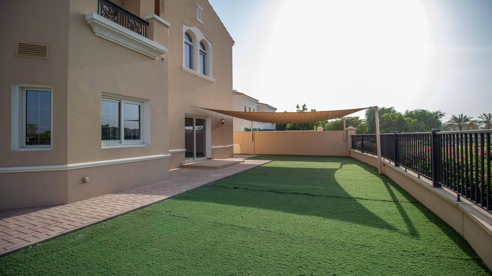 Spacious living room in luxury villa, La Avenida, Arabian Ranches, with large windows and marble floors