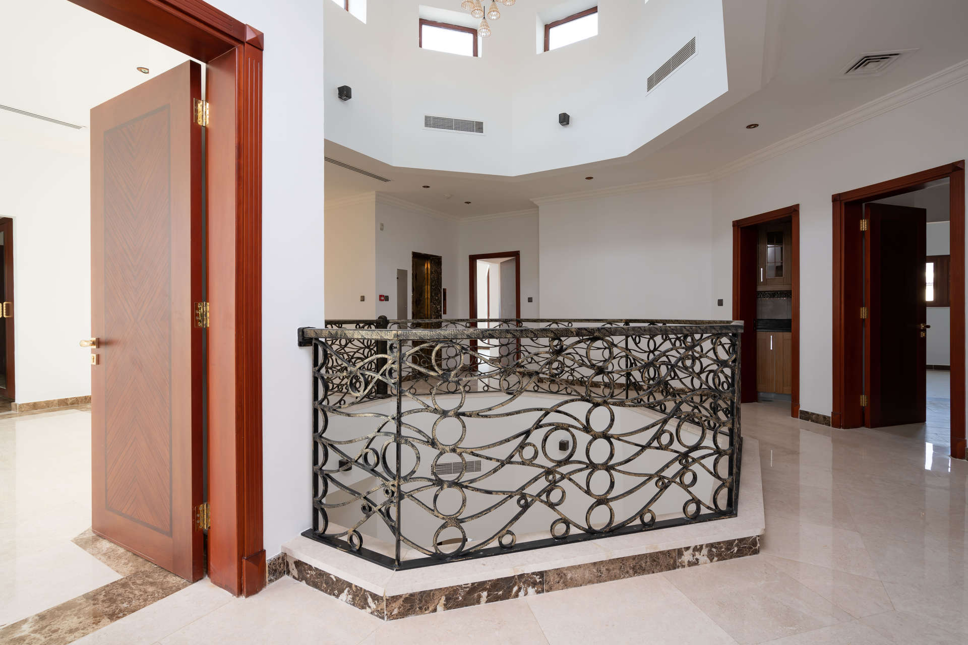 Elegant interior of 5-bedroom Tuscan villa in Jumeirah Golf Estates, featuring ornate railing