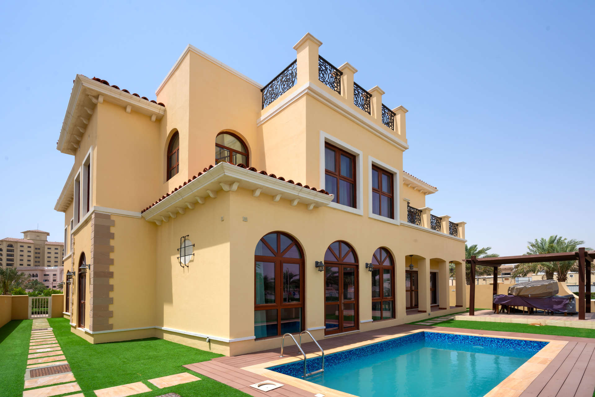 Modern kitchen with wooden cabinets in 5-bedroom villa, Orange Lake, Jumeirah Golf Estates