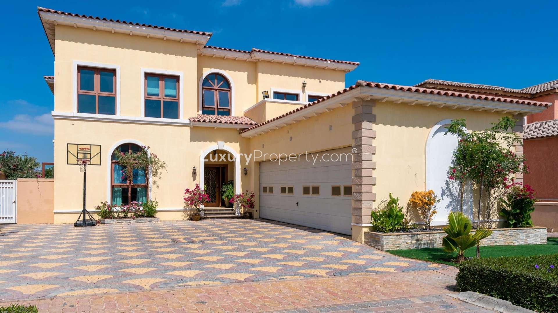 Luxurious villa patio with pool and garden in Jumeirah Golf Estates, Fire community