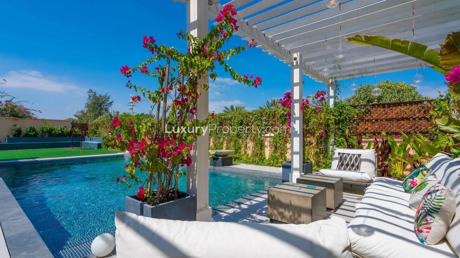 Luxurious living room in fully furnished villa, Jumeirah Golf Estates, modern decor, large windows