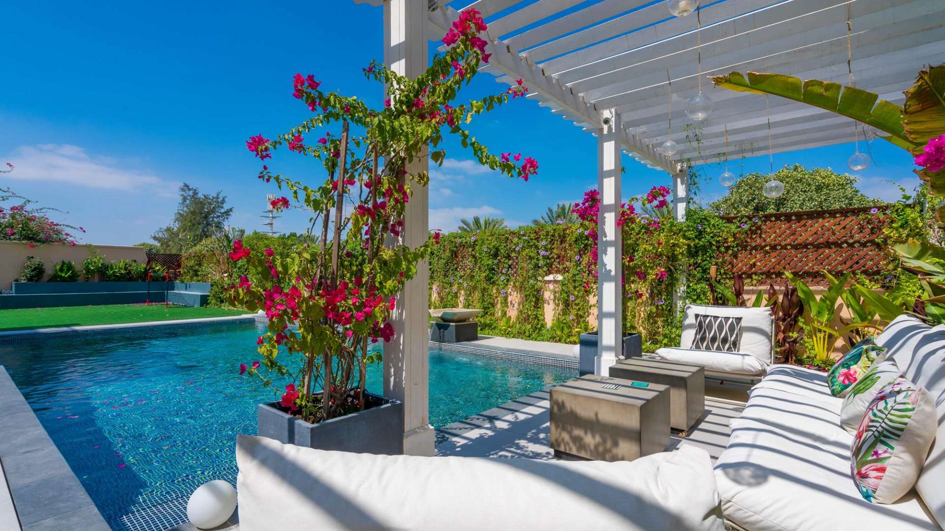 Luxurious living room in fully furnished villa, Jumeirah Golf Estates, modern decor, large windows