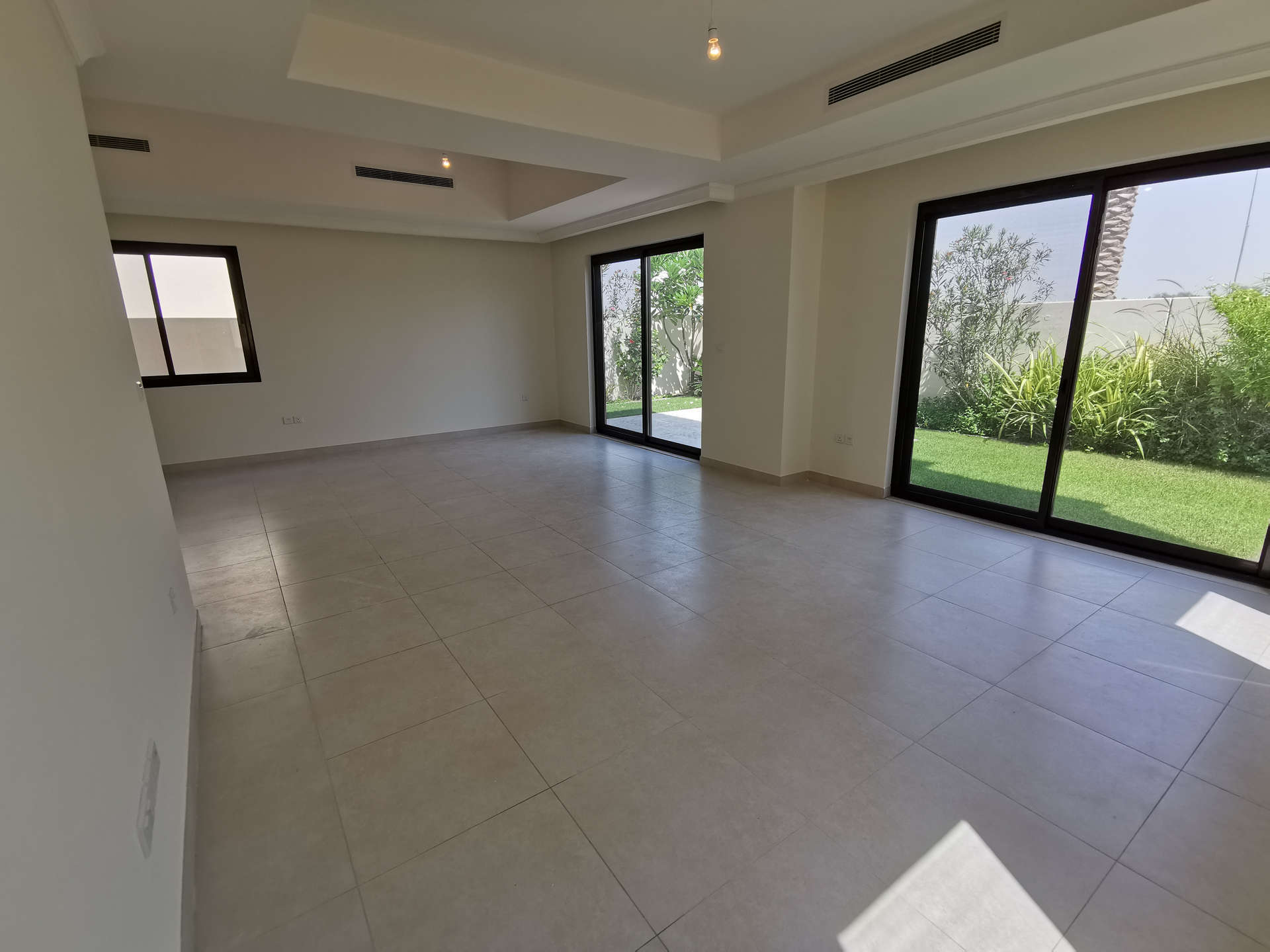 Spacious living area with garden view in 5-bedroom villa, Palma, Arabian Ranches 2, Dubai