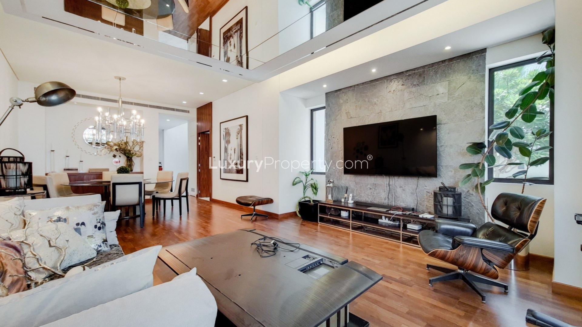 "Elegant entrance of Paramount Villa in Damac Hills' Picadilly Green, available for rent.",Luxury living room in Paramount Villa, Damac Hills, featuring modern decor and elegant furnishings