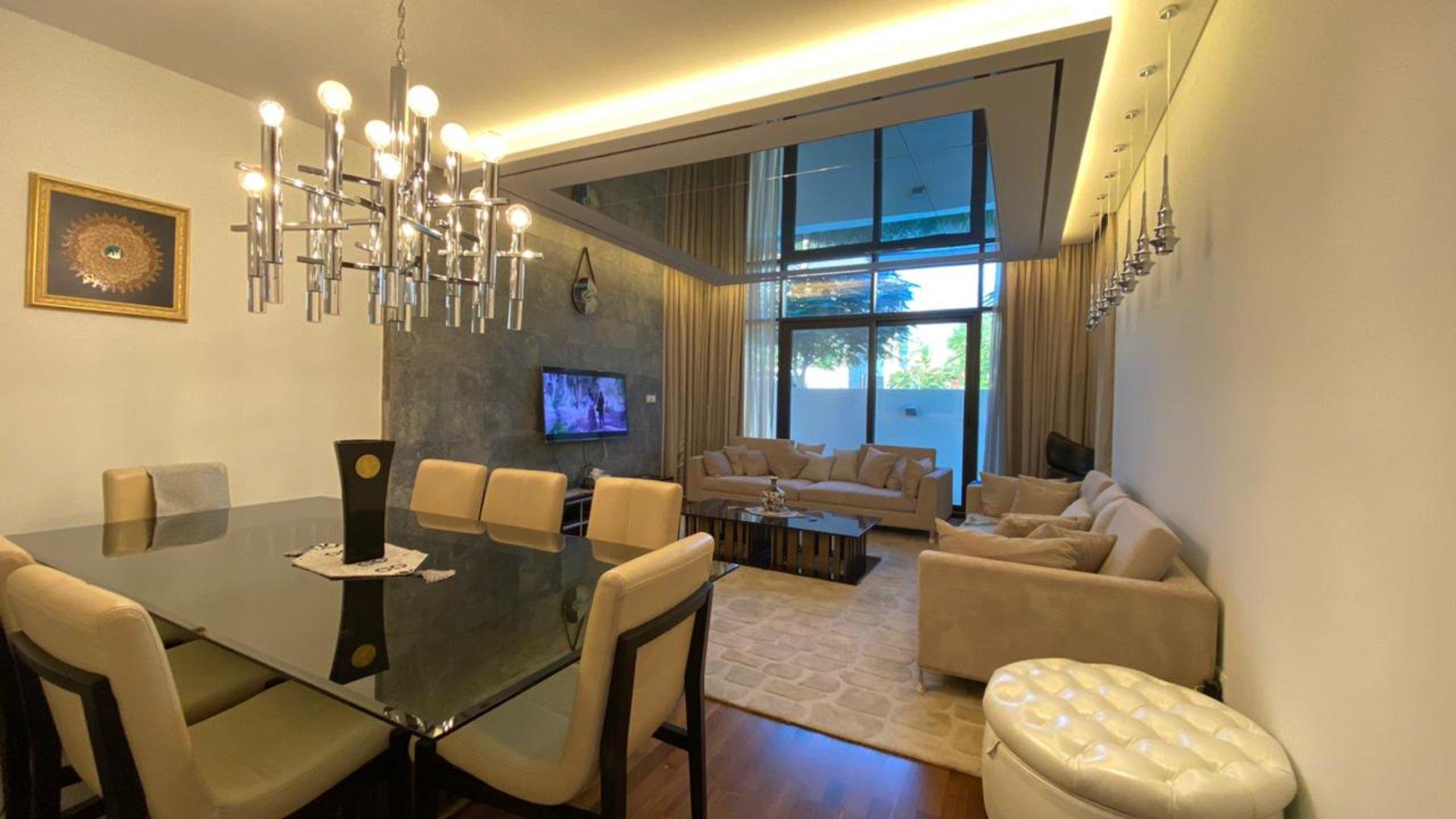 Modern 5-bedroom villa exterior in Picadilly Green, DAMAC Hills, with spacious lawn area