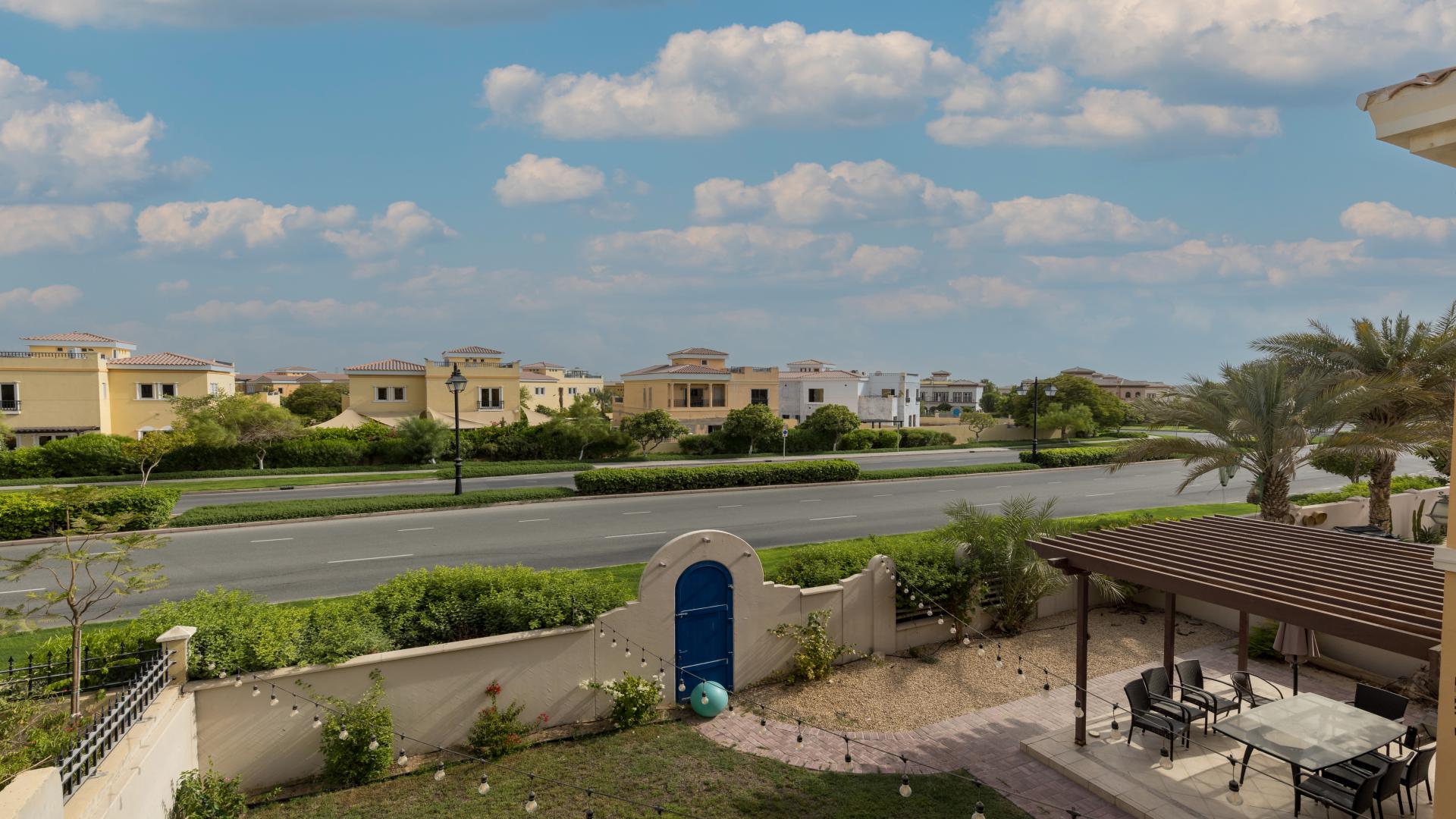 Spacious Spanish-style villa exterior with garden in Ponderosa, The Villa community for rent