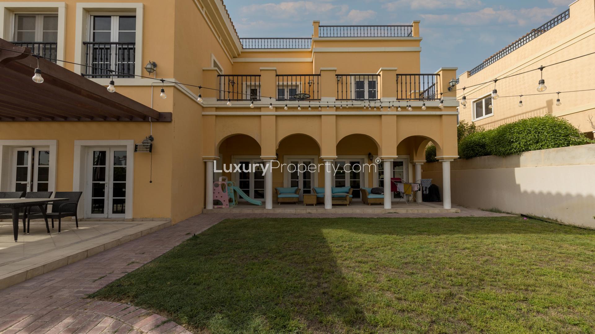 Spanish style villa exterior with patio, garden, and string lights in Ponderosa, The Villa