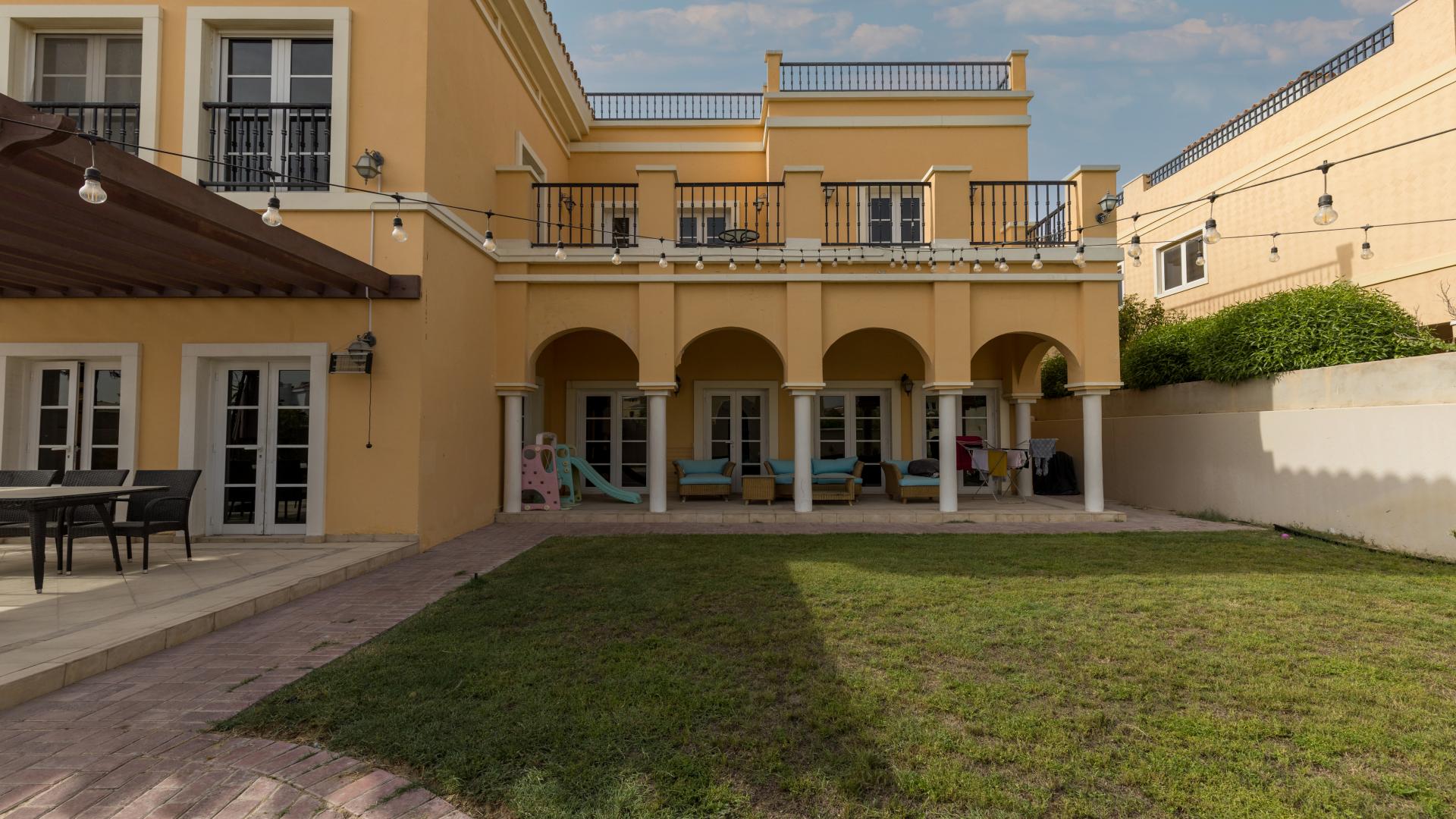 Spanish style villa exterior with patio, garden, and string lights in Ponderosa, The Villa