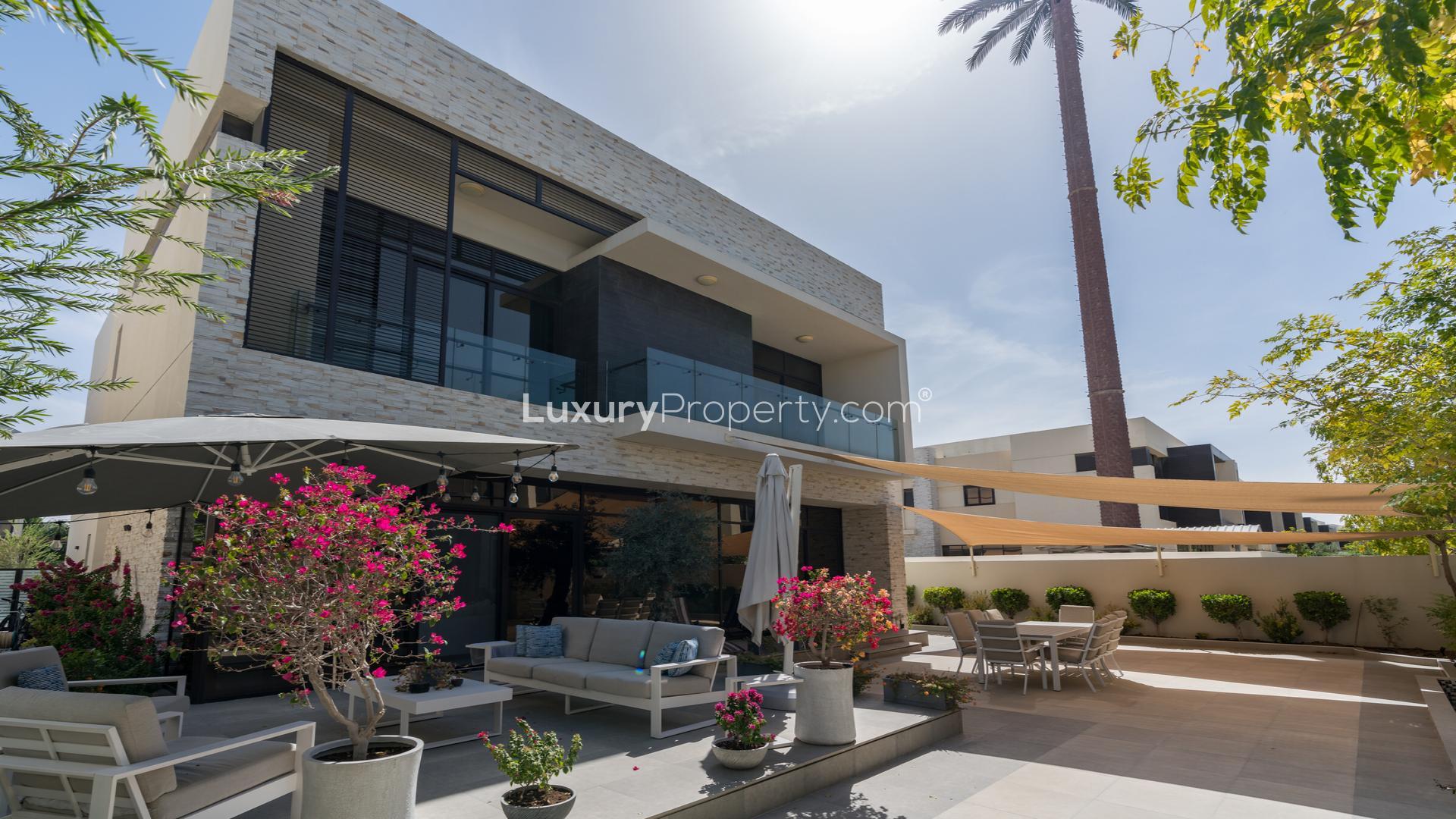 Luxurious open-plan living and dining area in 5-bedroom villa, The Field, Damac Hills