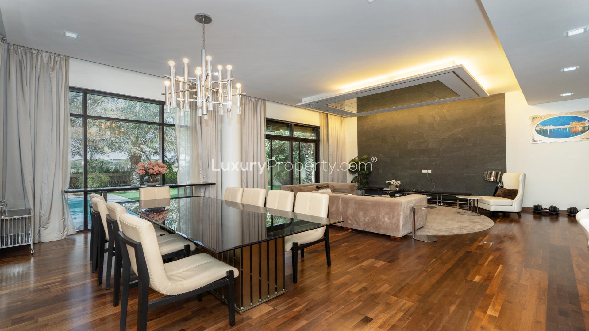 Luxurious living room in Damac Hills villa, featuring elegant decor and spacious seating area