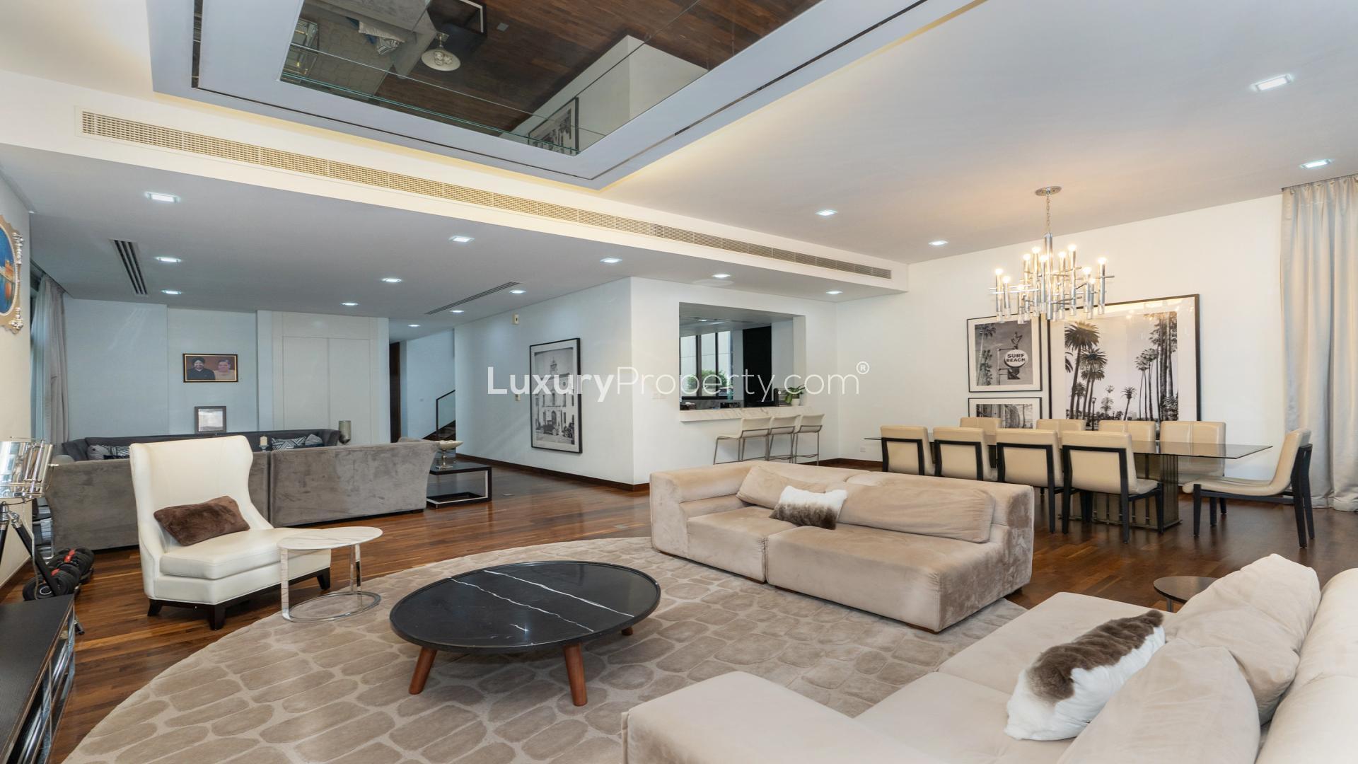 Modern villa exterior with landscaped garden in Damac Hills, The Field, available for rent