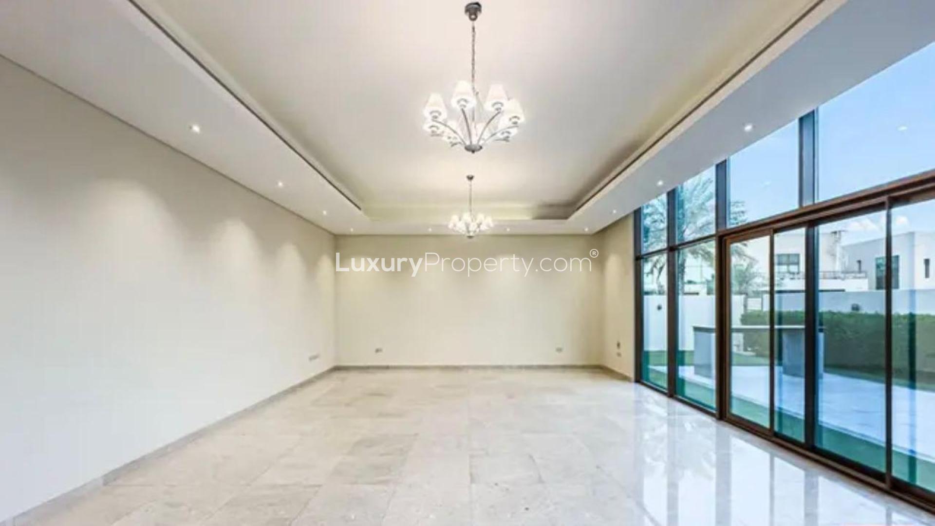 Spacious living room in Meydan villa with large windows and elegant lighting fixtures