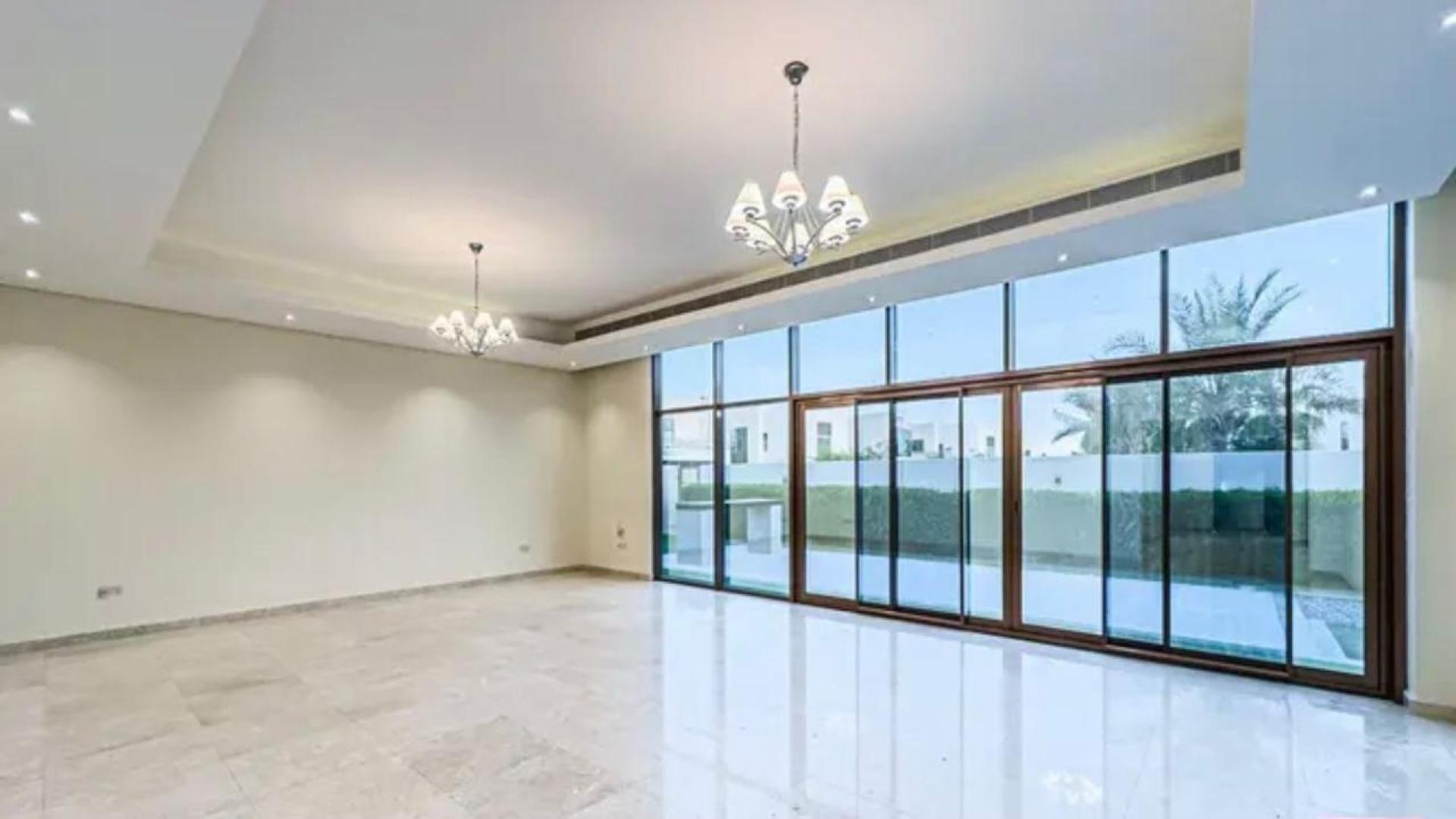 Spacious Meydan villa interior with elegant staircase and large windows for natural light