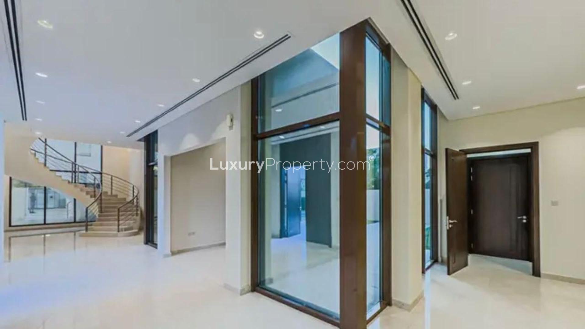 Premium 5-bedroom villa exterior with garden path in Meydan Gated Community for rent