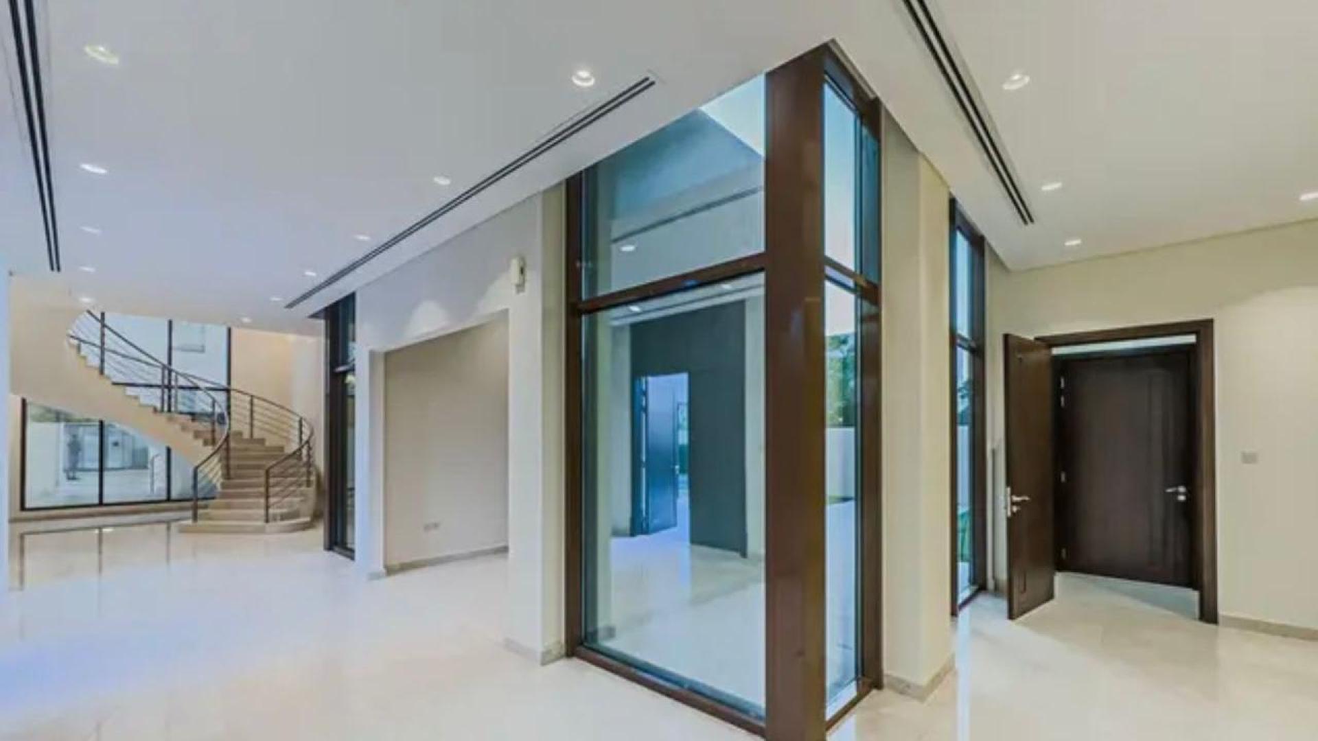 Premium 5-bedroom villa exterior with garden path in Meydan Gated Community for rent