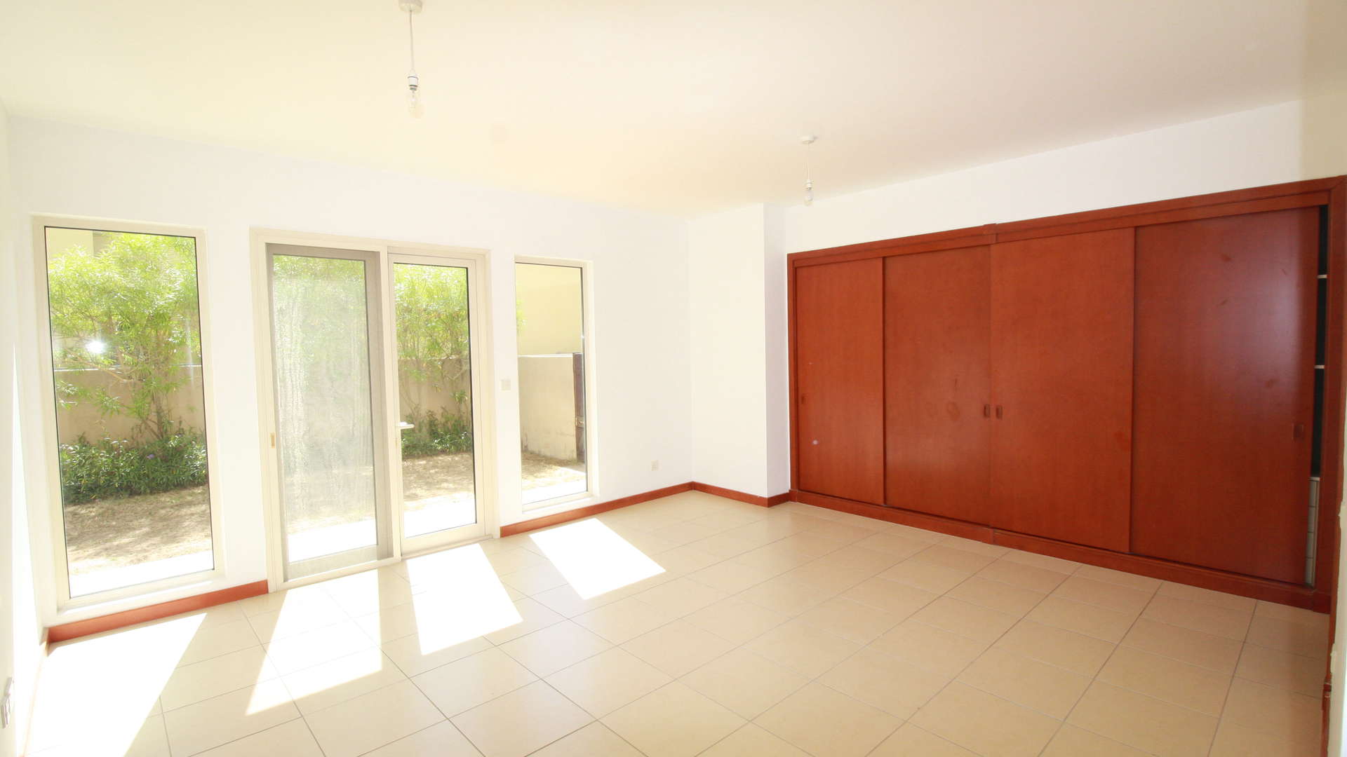 Modern kitchen in 5-bedroom villa, Saheel, Arabian Ranches, featuring spacious wooden cabinetry