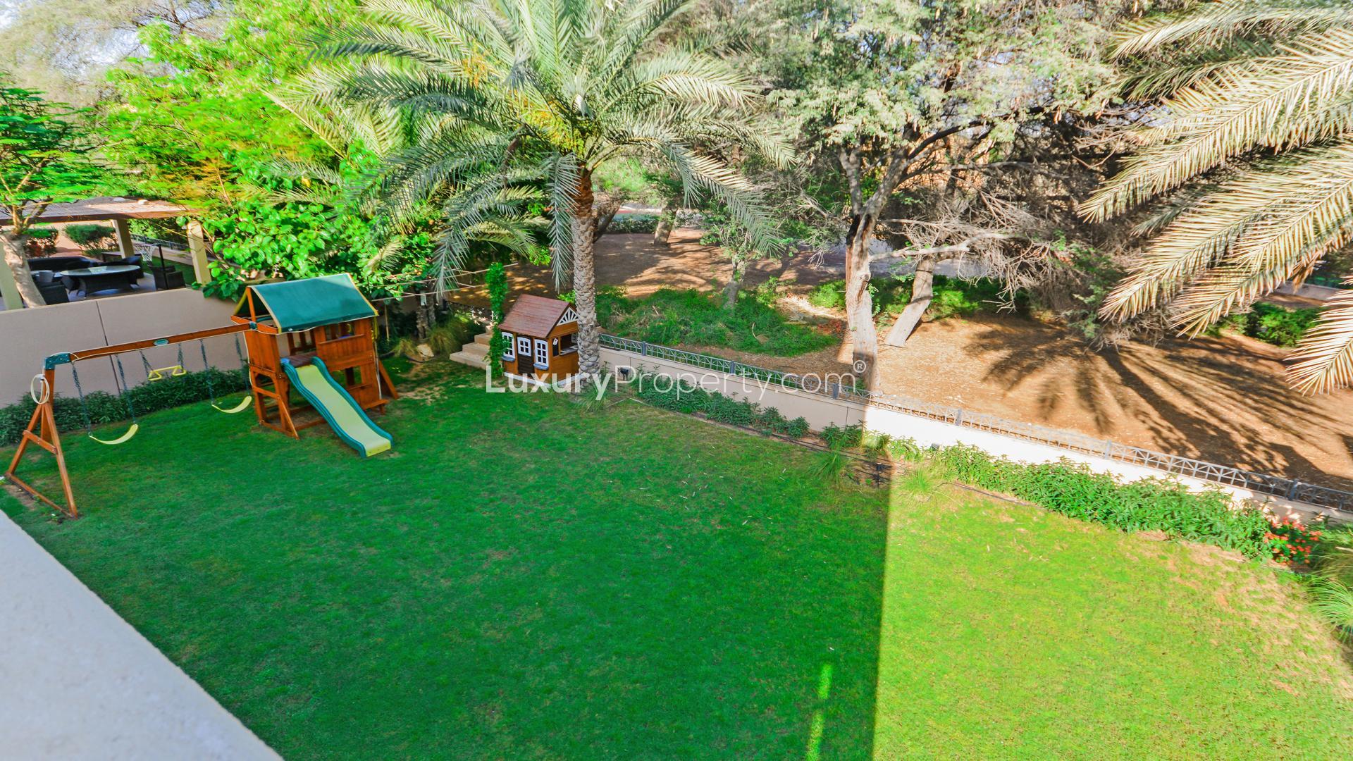 Expansive garden with playset at 3-bedroom villa in Saheel 1, Arabian Ranches